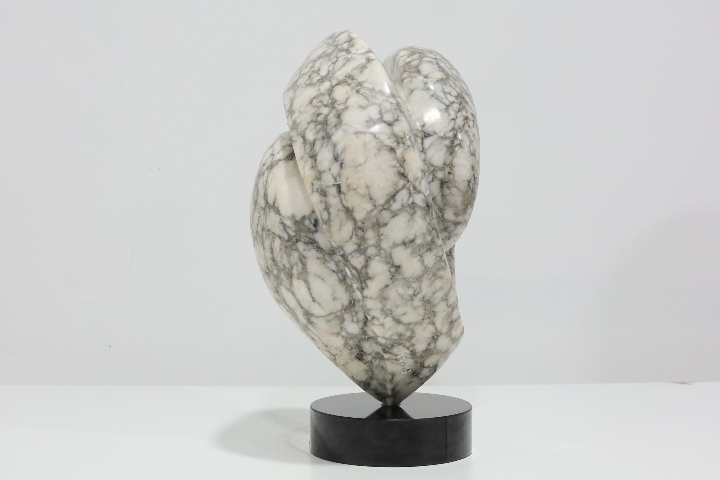 Impressive large scale abstract marble sculpture mounted on a plinth base. Signed Gary G. and dtd. 1983. This is very heavy and would look great on a pedestal.
