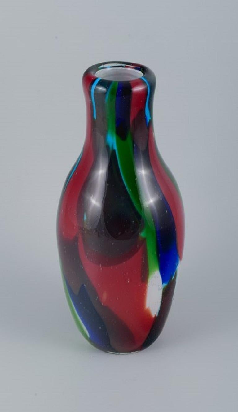 Large mouth-blown Murano vase in art glass.
Multicolored in a modern design.
circa 1970s.
In perfect condition.
Dimensions: H 36.5 x D 14.0 cm.