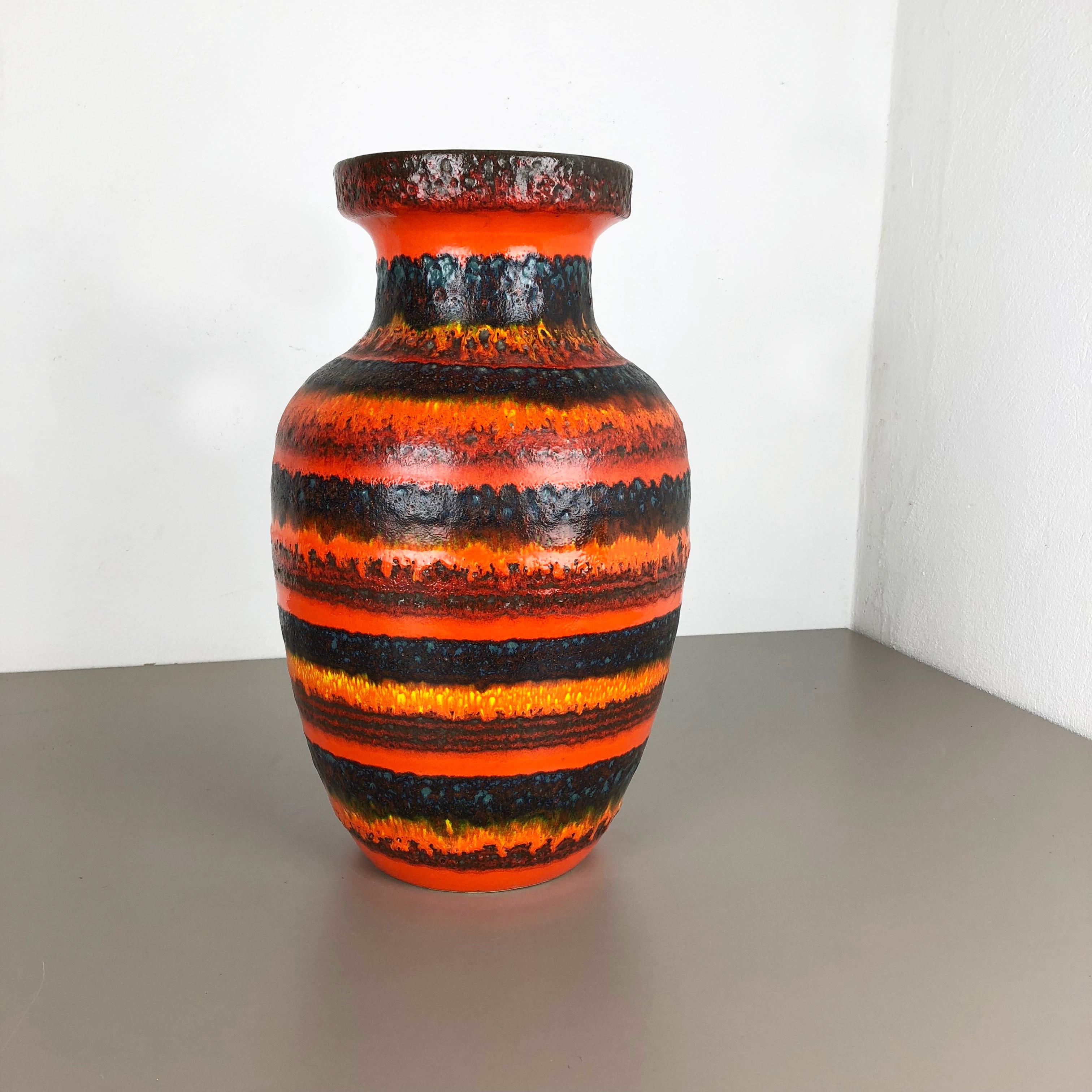 Article:

Fat lava art vase XXXL version



Producer:

Scheurich, Germany



Decade:

1970s


This original vintage vase was produced in the 1970s in Germany. It is made of ceramic pottery in fat lava optic with abstract