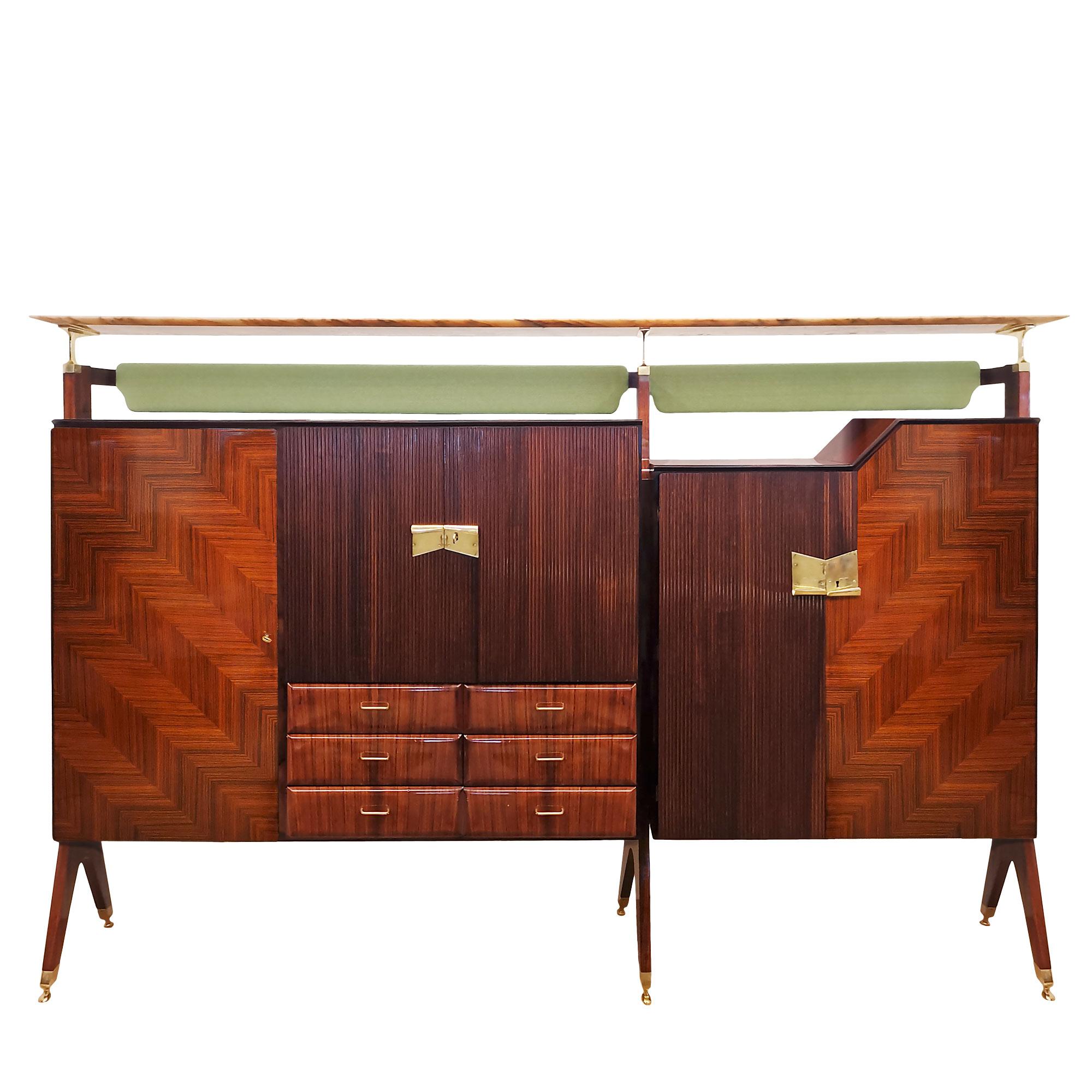 Large removable multi-purpose piece of furniture in solid wood veneered with walnut, walnut marquetry in “chevrons” pattern; three doors in “grissinis” of solid sapele; illuminated mirrored bar.

Interiors in sycamore and ebony mouldings; feet,