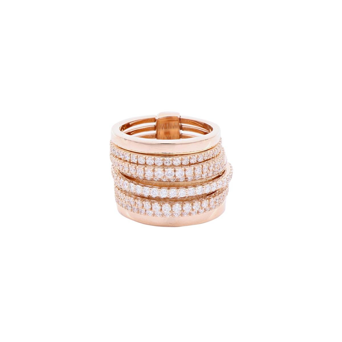 Made up of nonaligned rings, this 18Kt red gold band ring features plain rows on the outside and diamond pavé ones at the center, creating a modern and elegantly balanced look.

This piece of jewelry is highly exclusive, handmade with love by the