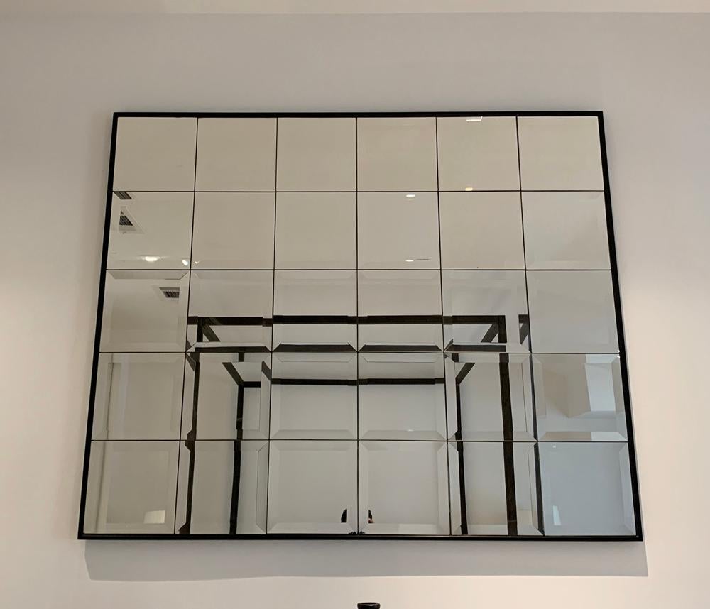 Beautiful multipanel mirror with beveled edges and a wooden frame, in excellent condition.

Measurements:
54 inches wide x 44 inches high x 1 inch thick.