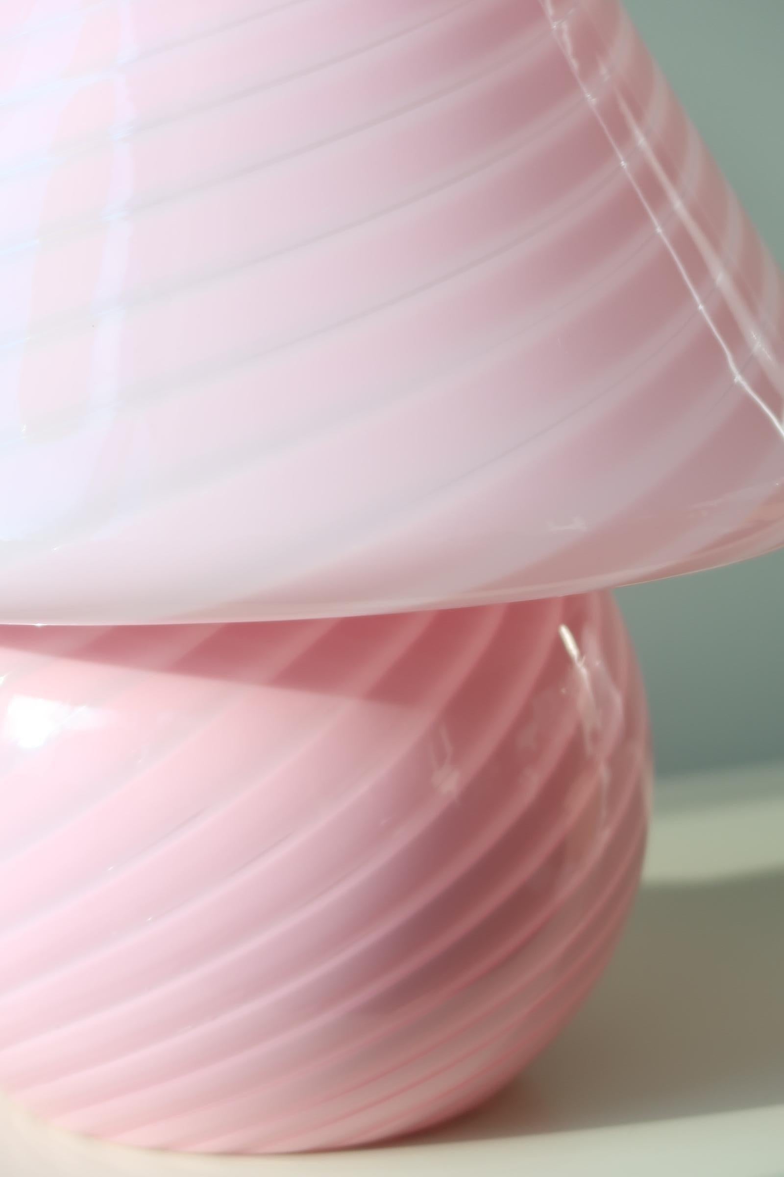 Extra large vintage Murano mushroom lamp in the most amazing pink / bubble gum shade. The lamp is mouth-blown in one piece of glass with a swirl and gives a really cozy light. Handmade in Italy, 1970s, and comes with new fabric cord.

Measures:
