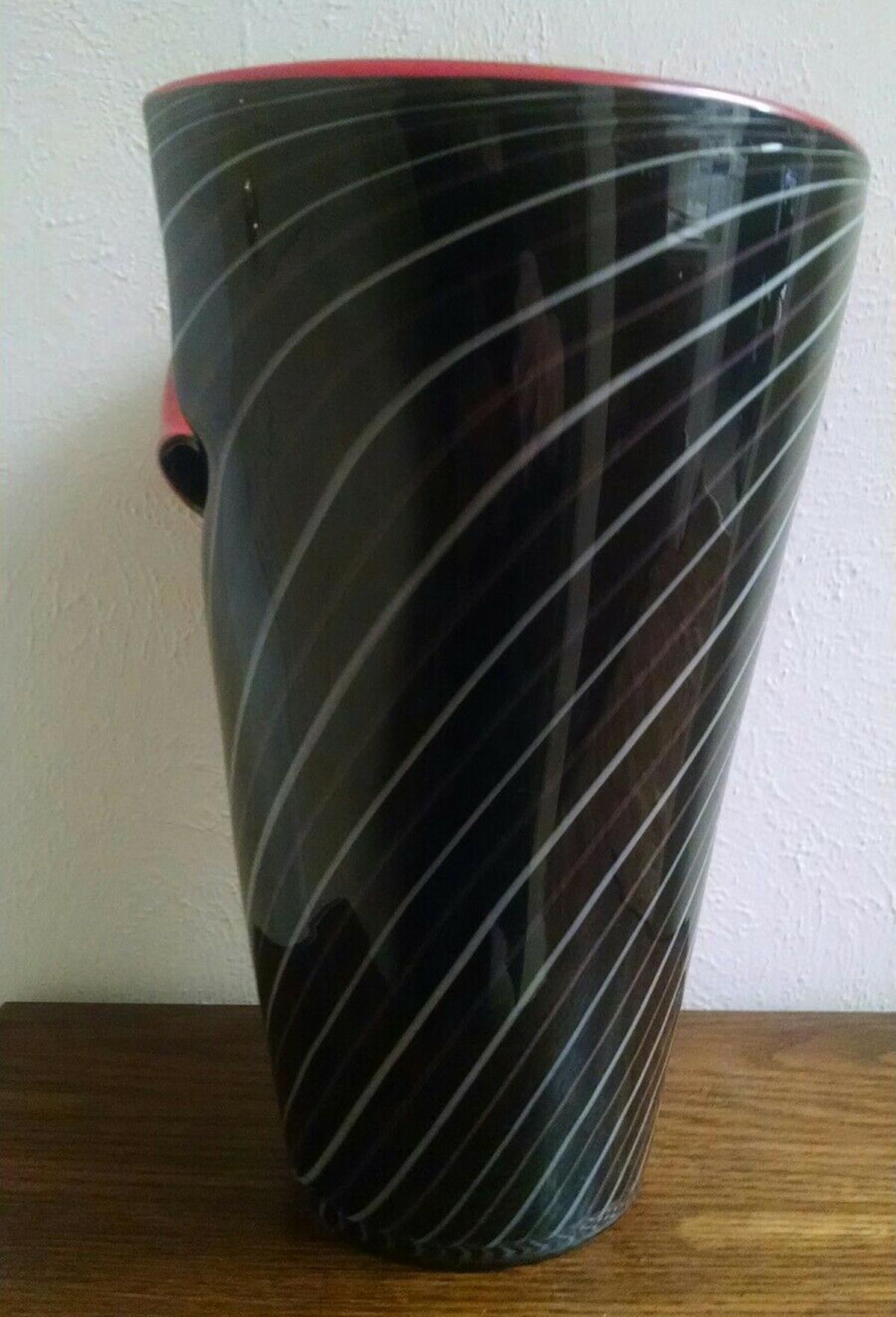 For the lovers of Murano, a spectacular large art glass vase created by Alberto Dona for Barovier and Toso Murano, Italy. The vase is cased black with white and grey stripes. It has a cut and folded back section along the rim to show its fabulous