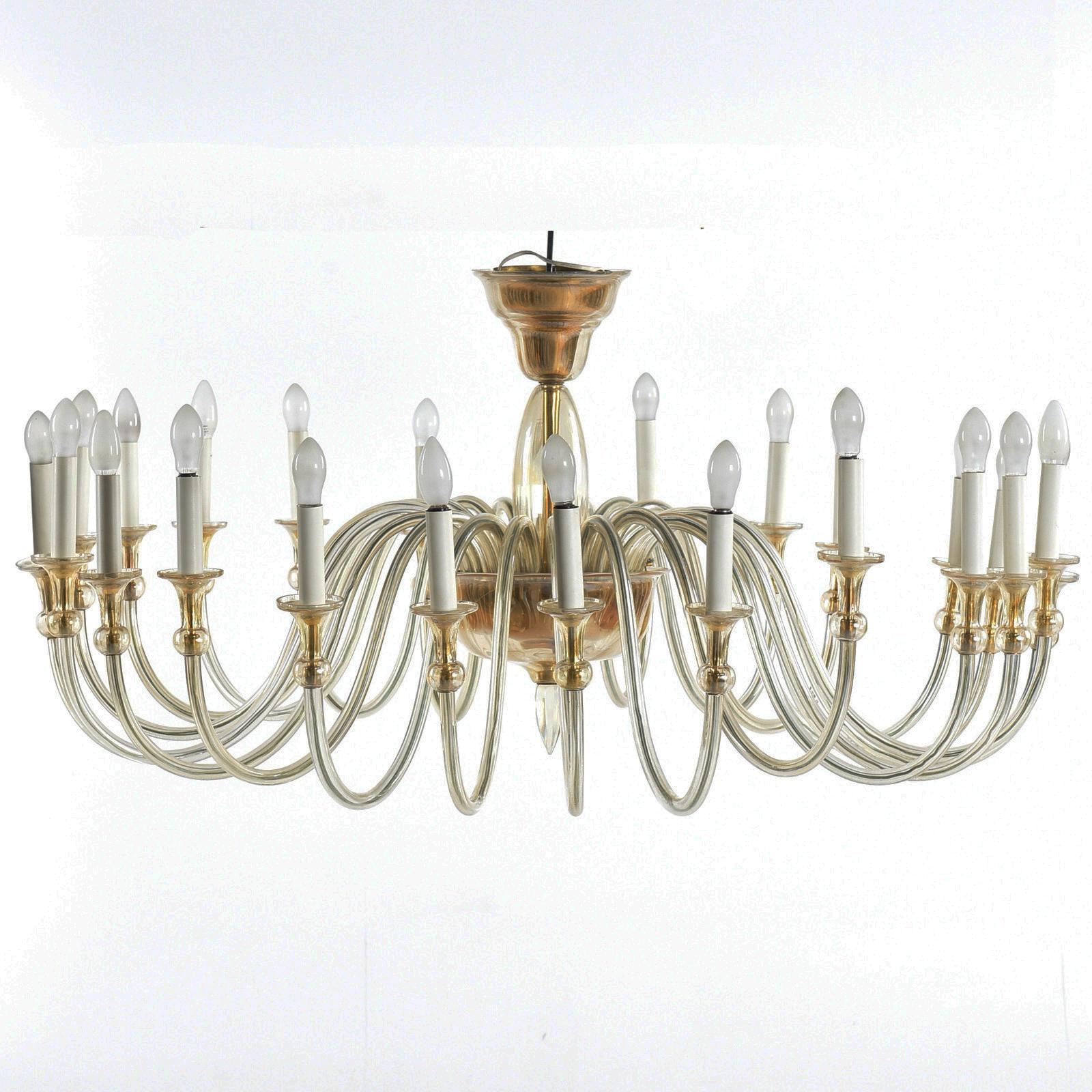 Large Murano amber-glass chandelier with 24 arms, fitted with E14 sockets. Made in the 1950s in Italy.
Will be delivered in a wooden box.