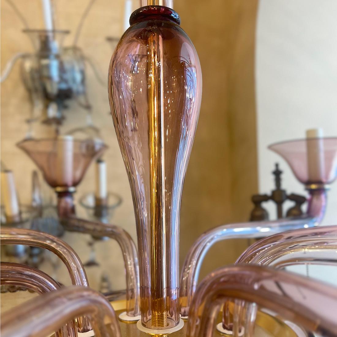 A circa 1950's large Italian amethyst Murano glass double-tier twelve-arm chandelier.

Measurements:
Height: 56