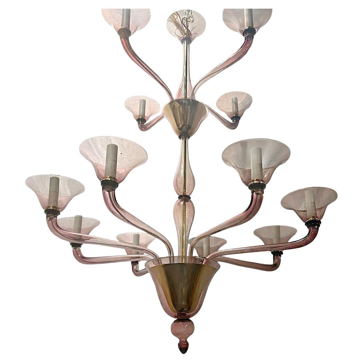 Grande lampadario a dodici bracci in vetro di Murano ametista degli anni '50 circa.

Misure:
Altezza: 56