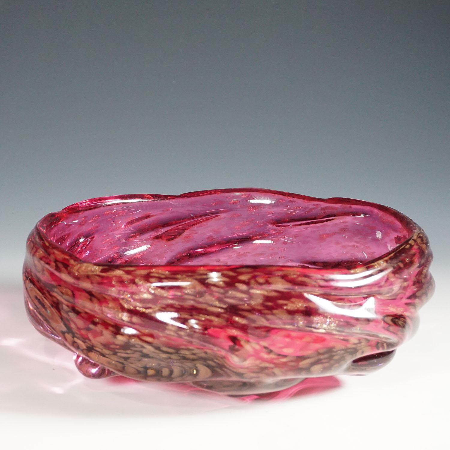 A large Murano glass bowl most probably manufactured by Seguso Vetri d'Arte and designed by Flavio Poli circa 1950s. thick pink glass with aventurine inclusions and a clear glass overlay. 
Lit.:
marc heiremans, Seguso Vetri d'Arte, stuttgart 2014,