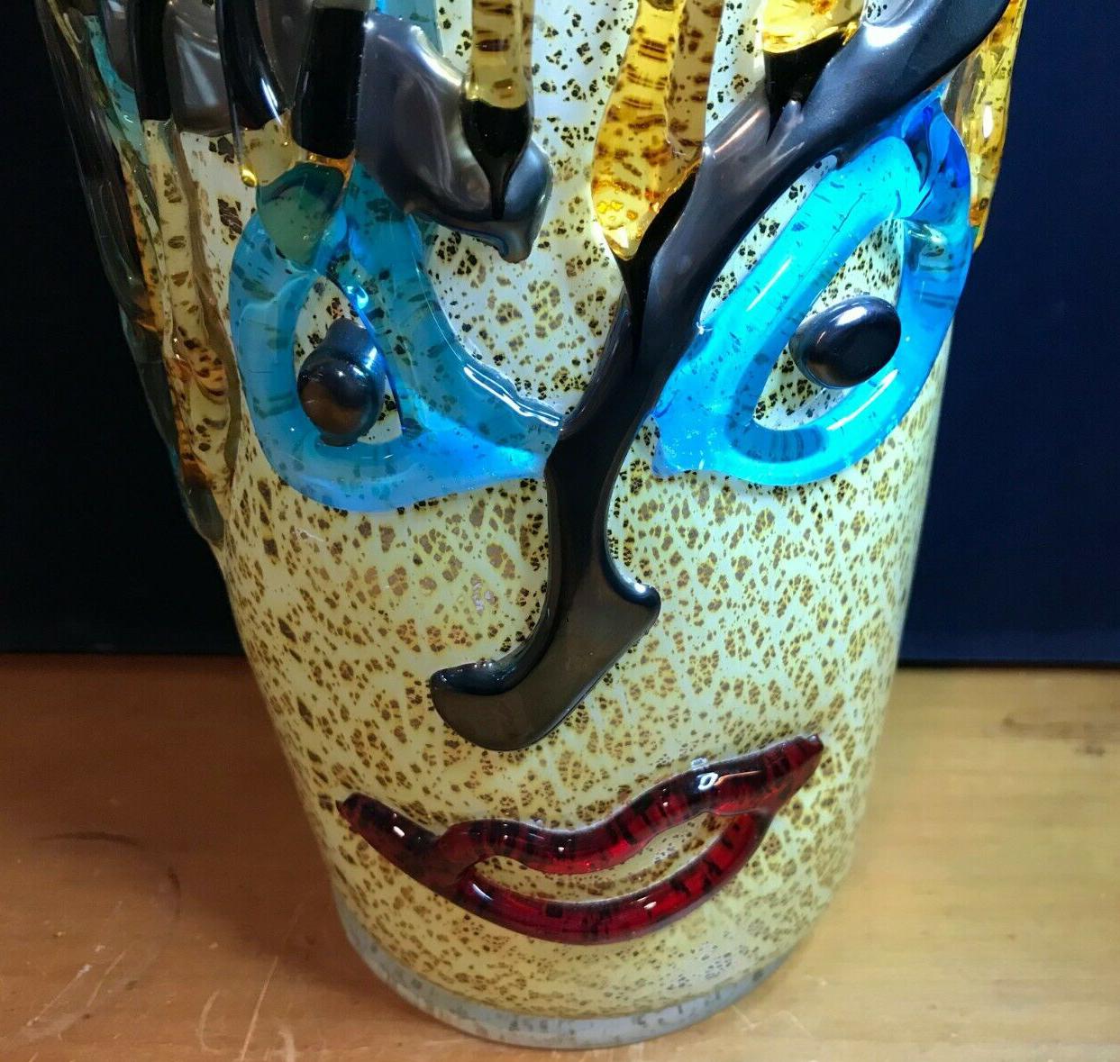 Mid-Century Modern large Murano art glass flamboyant face vase, signed by Sergio Constantini. A top quality art glass with an amazing display of multi colored reflection when the light hits the glass example, the color can appear to be more intense