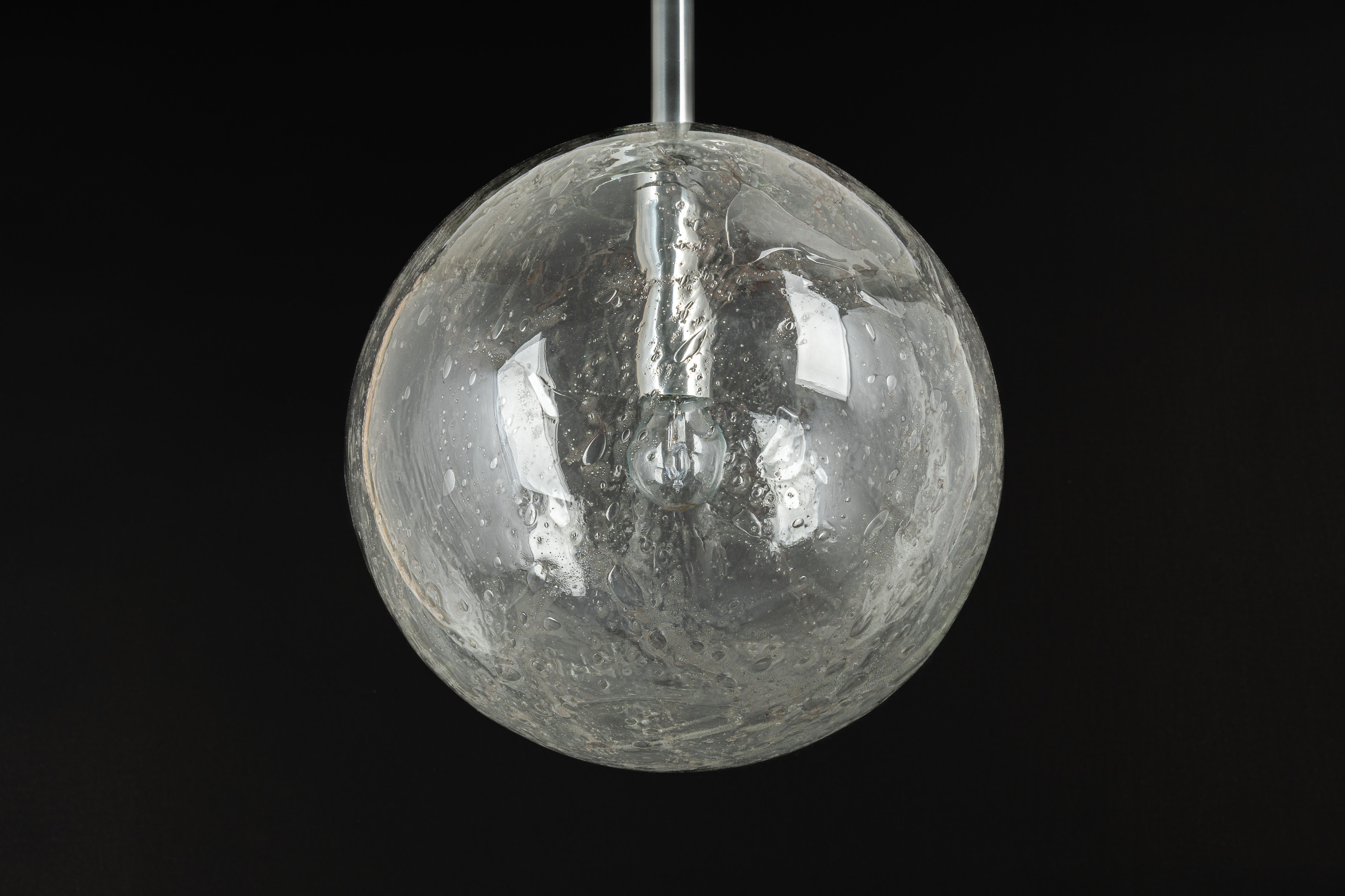 Doria ceiling light with nice Murano glass ball.
High quality of materials, gives a wonderful light effect when it is on.
Very good condition. Cleaned, well-wired, and ready to use. 
The fixture requires one standard bulb (E-27)
Light bulbs are