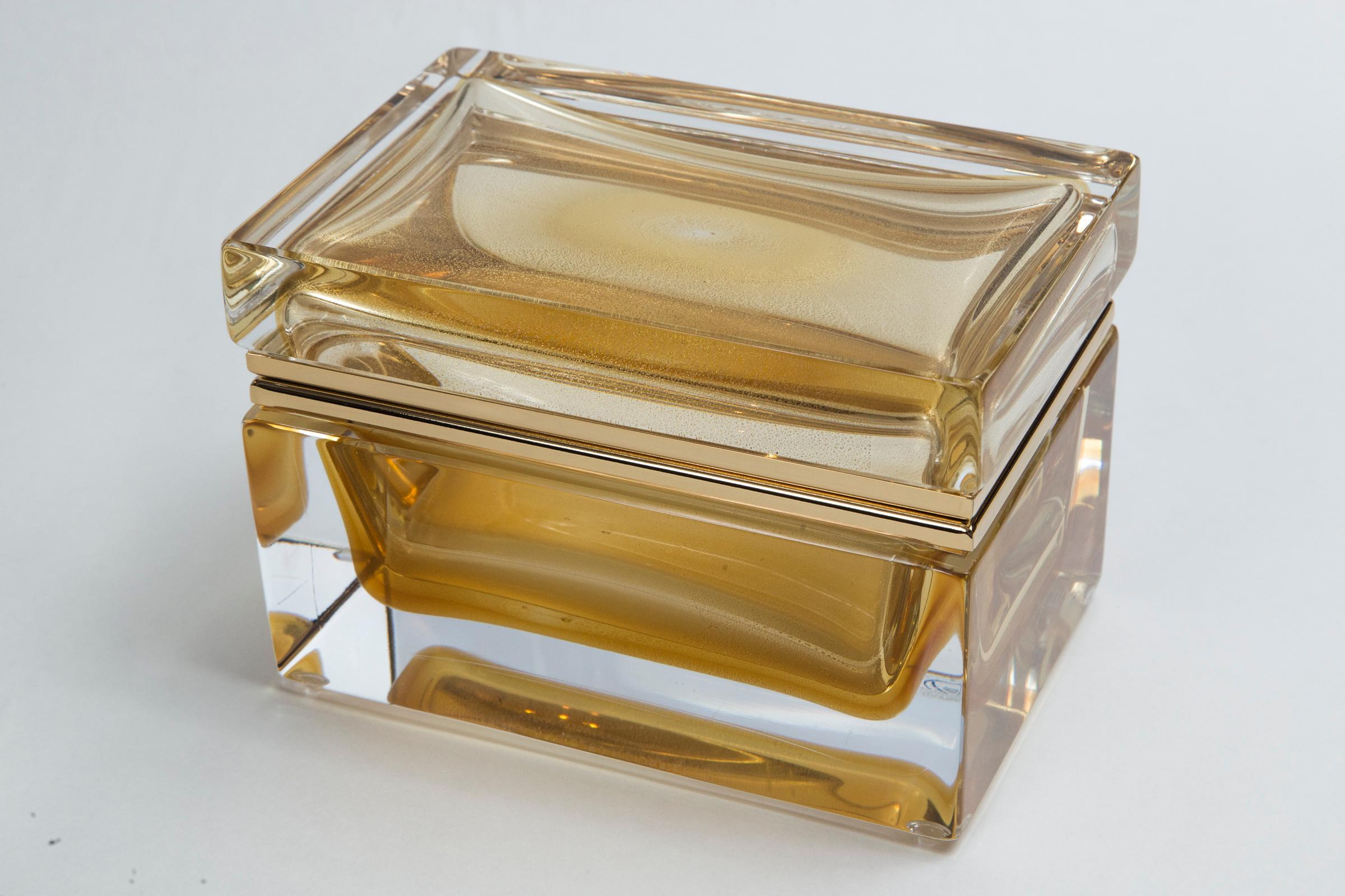 One of a kind Murano handcrafted large rectangular shaped clear blown glass box with floating 24-karat gold orb center, customized sizing for each box with 14-karat gold on brass fittings.
Boxes are signed by the artist.
Origin: Murano,