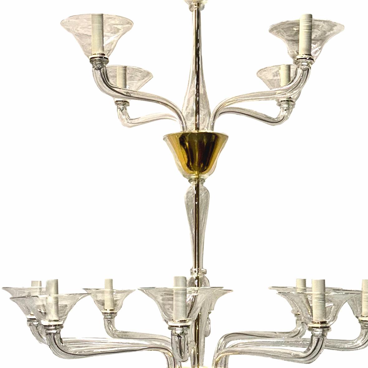 A circa 1950’s large Italian clear Murano glass double-tier twelve-arm chandelier.

Measurements:
Height: 56″
Diameter: 41″