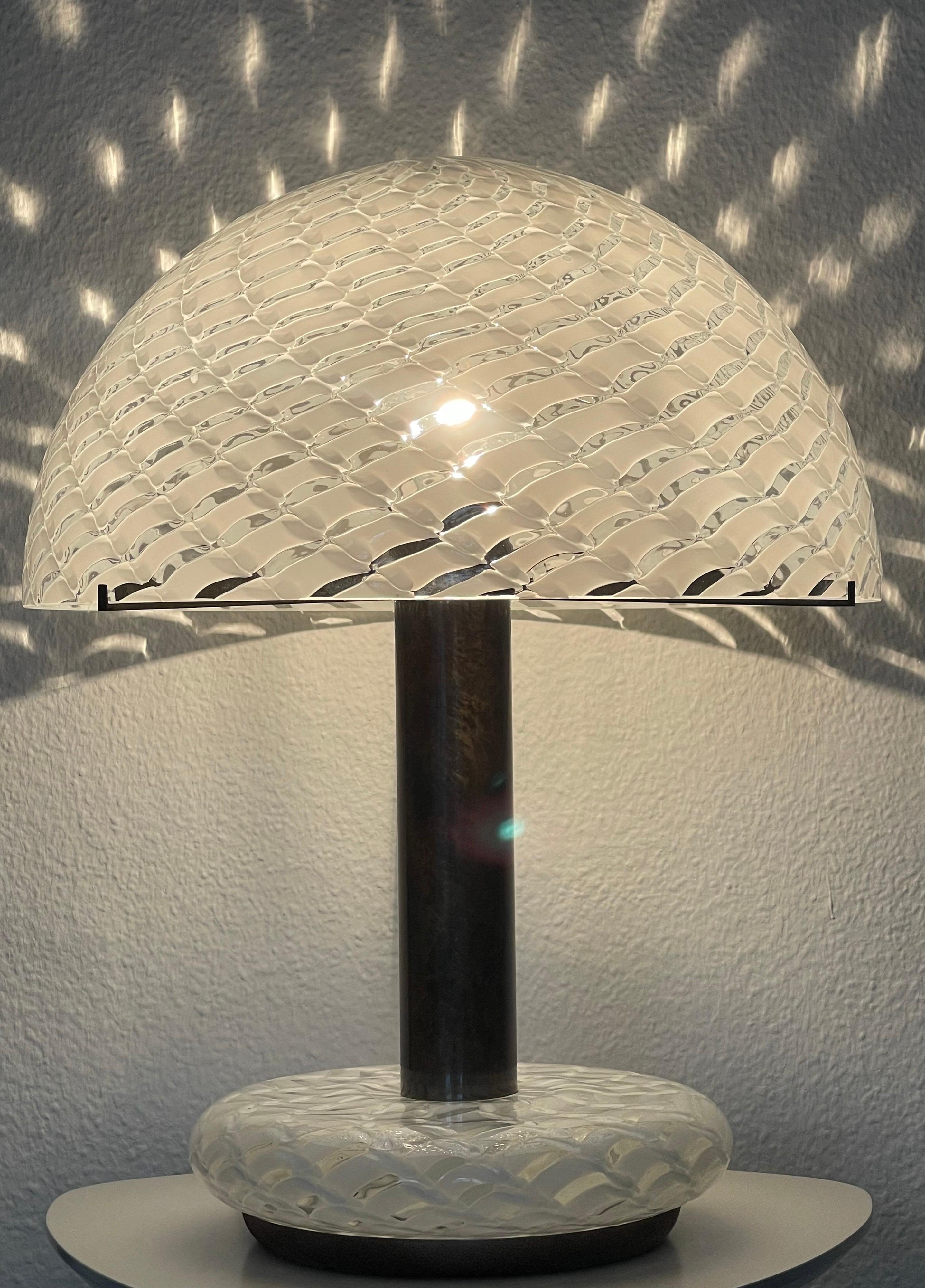 A very rare mid -century Murano glass mushroom table lamp by Venini, Italy, circa 1960s.
Socket: one x e27 for standard screw bulbs.



 