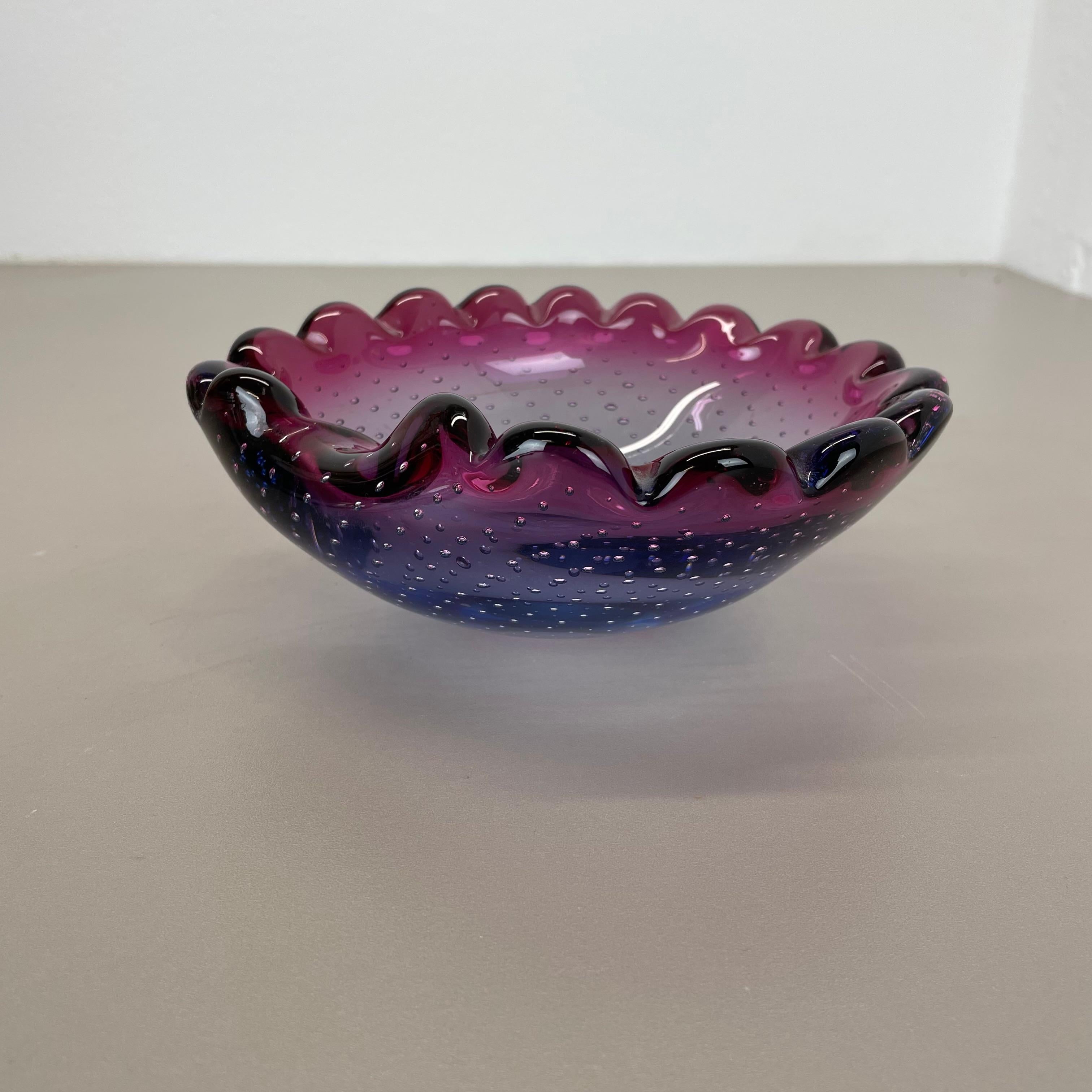 Article:

Murano glass bowl element  ashtray


Origin:

Murano, Italy


Decade:

1970s


This original glass element was produced in the 1970s in Murano, Italy. An elegant light brown Murano glass element utilizing the bullicante technique of