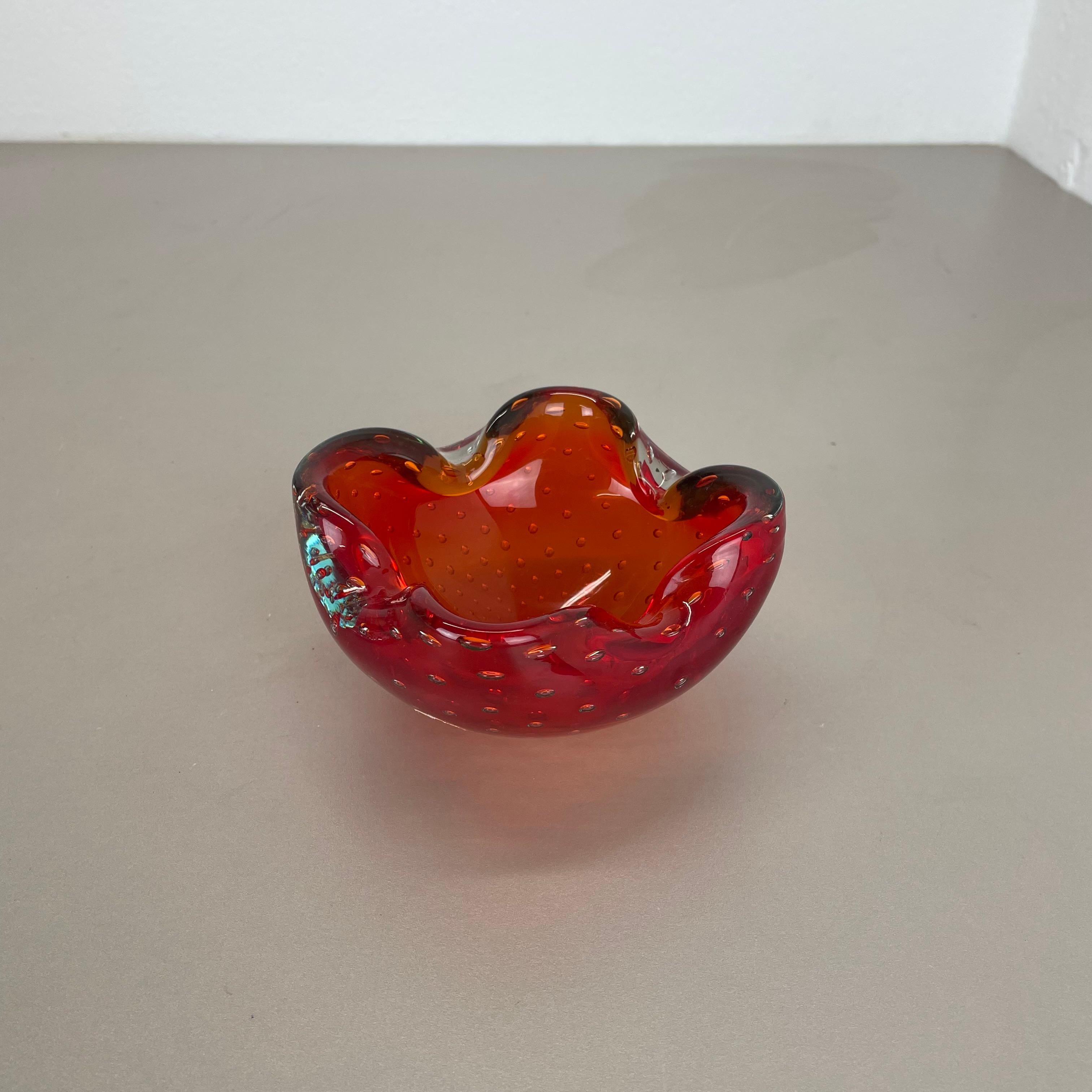 Article:

Murano glass bowl element  ashtray


Origin:

Murano, Italy


Decade:

1970s


This original glass element was produced in the 1970s in Murano, Italy. An elegant red Murano glass element utilizing the bullicante technique of controlled