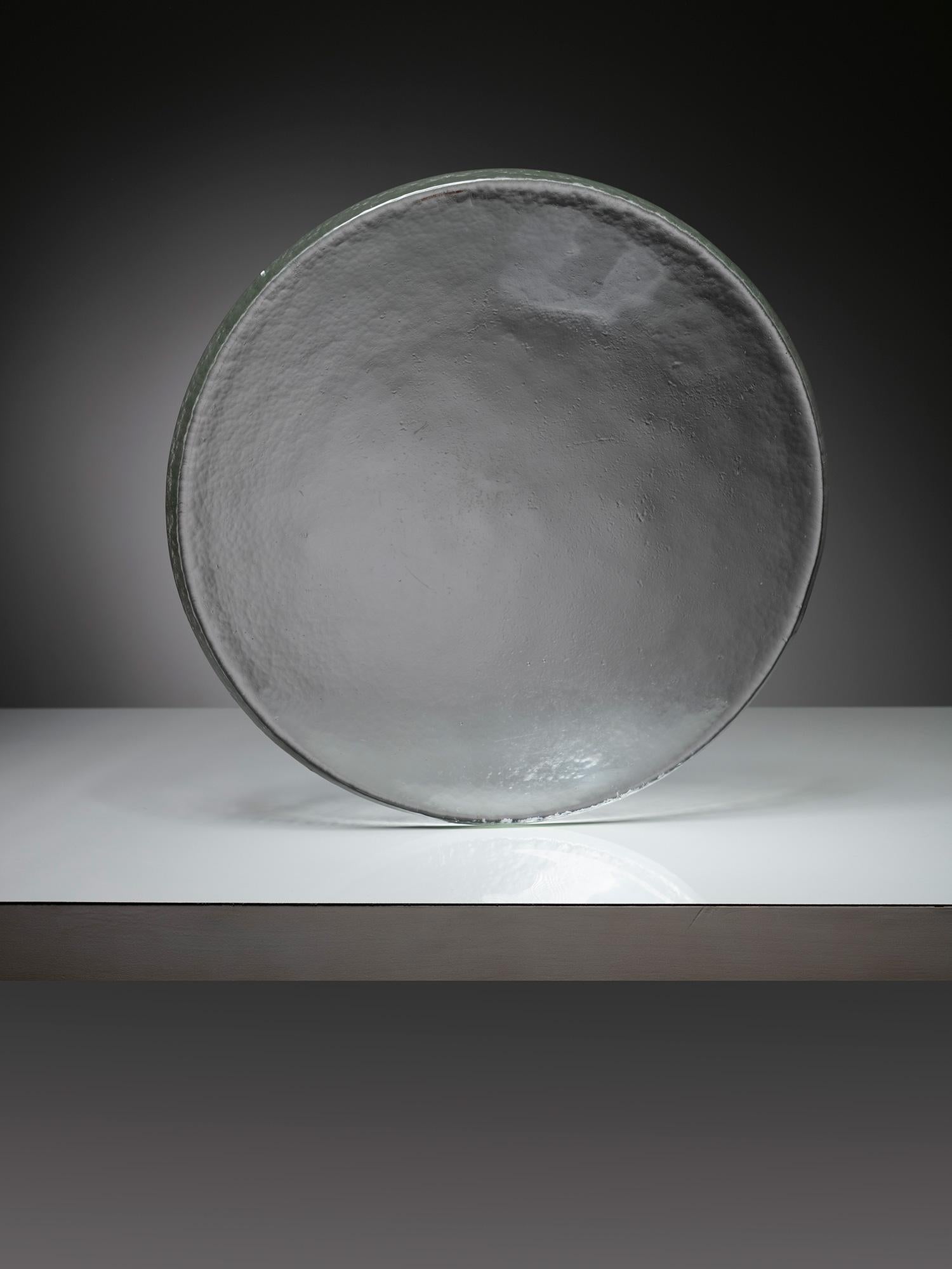 Murano glass centerpiece by Barbini.
Imposing thick glass lens shaped piece with hammered surface