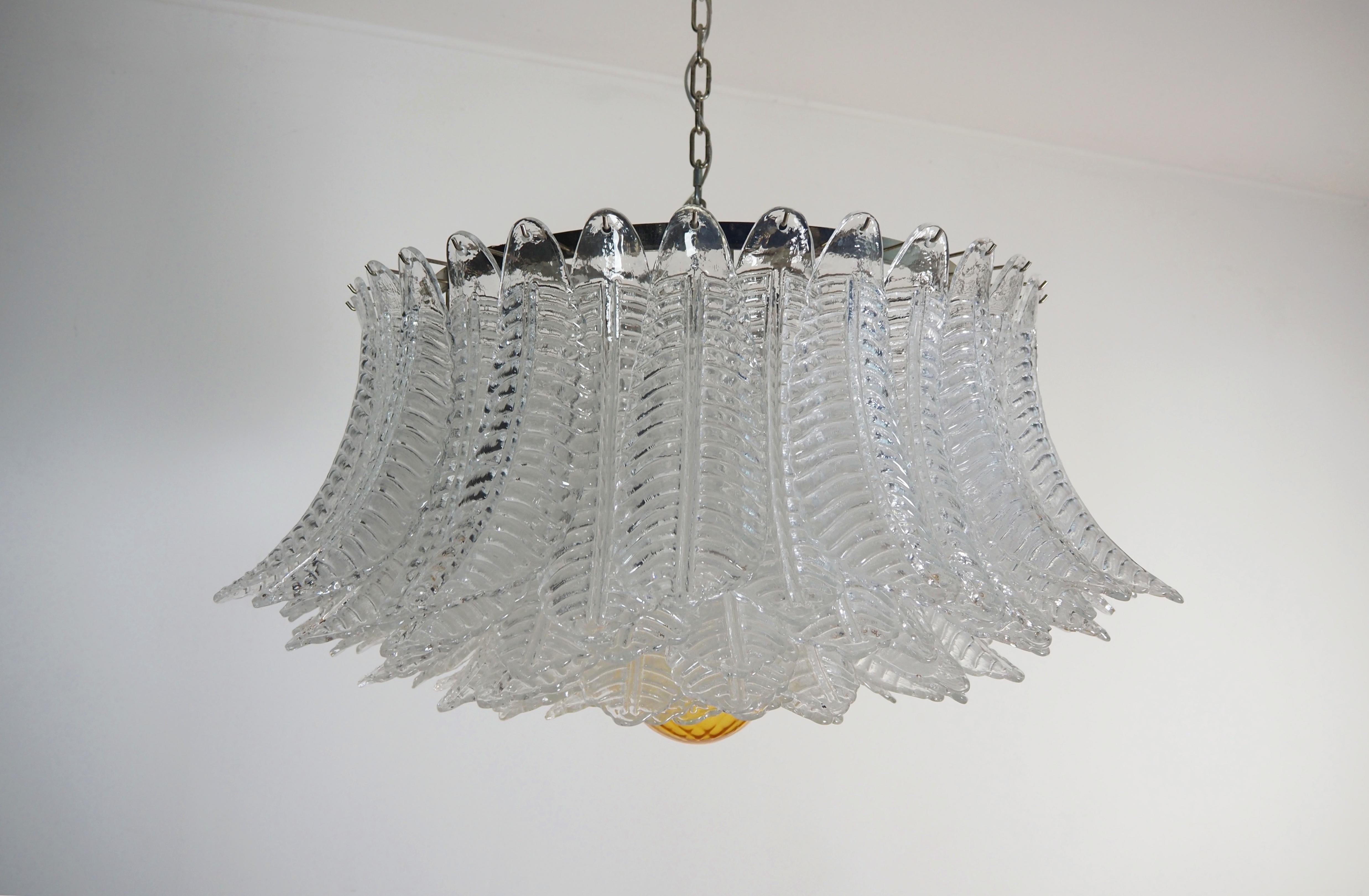 Italian vintage chandelier in Murano glass and nickel plated metal structure. The armor polished nickel supports 100 large transparent glass leaves felci plus a  amber glass sphere used as finish. Can be used as a chandelier with chain, or as a