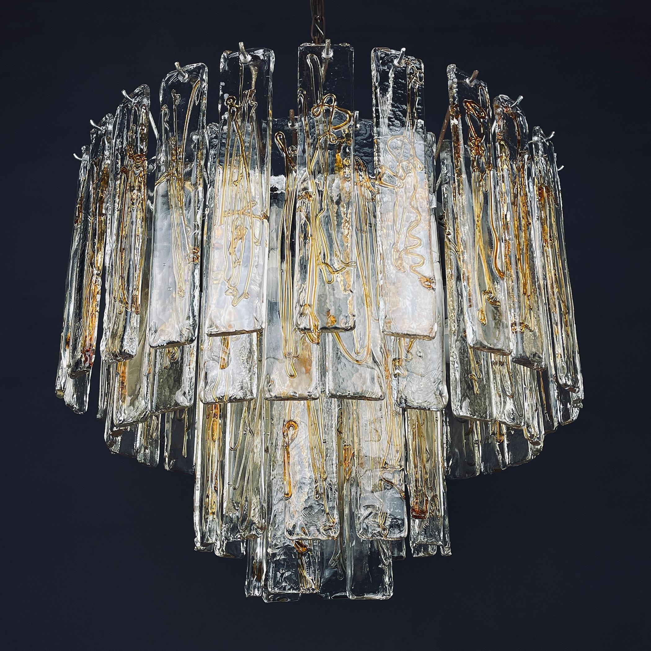 The absolutely fantastic vintage large Murano glass chandelier by La Murrina made in Italy in the 1970s. La Murrina is a symbol of excellence in design with unique glass products “Made in Murano”. Thanks to its strong roots and high artisan skills,