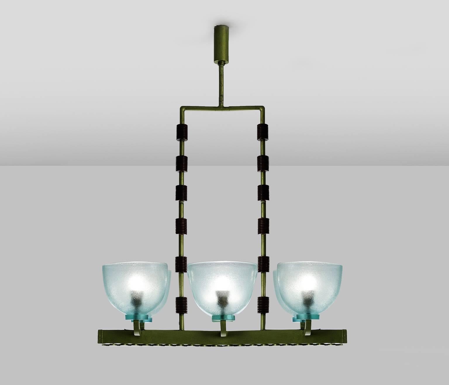 Chandelier in Murano glass, wood and metal by Seguso, Italy, 1940s. 

Large Murano glass chandelier by Seguso. This wonderful chandelier has a soft green frame in metal, with wooden decorative cylinder shaped elements onto the vertical tubular