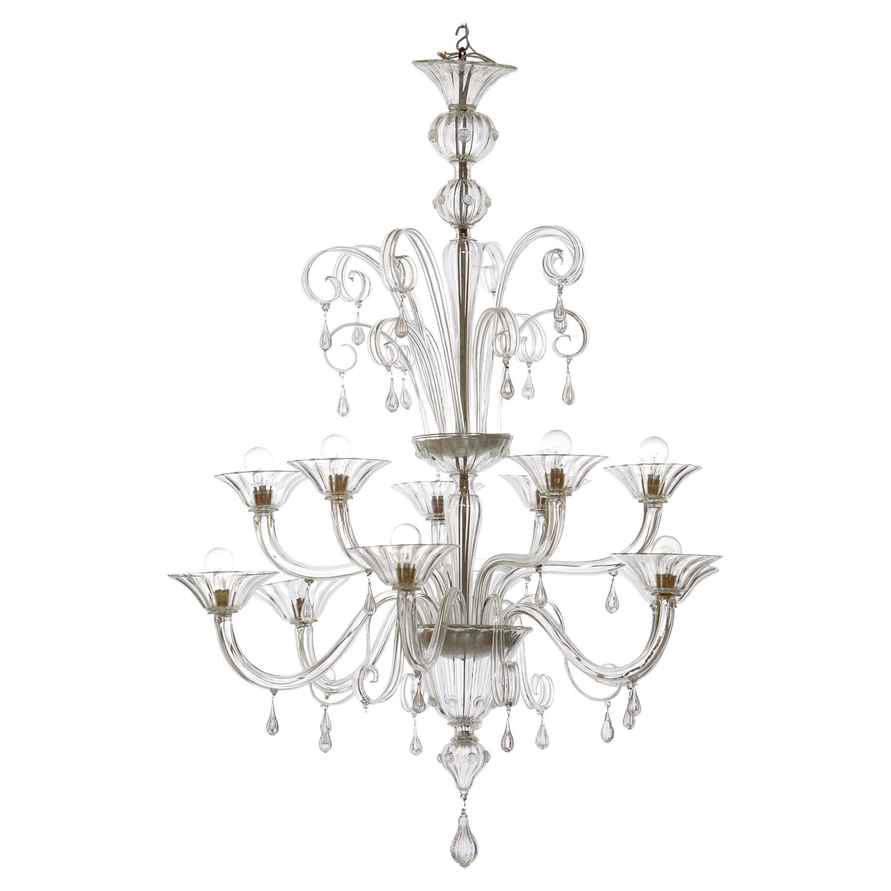 Large Murano glass chandelier, Italy 1940.
Beautiful chandelier with 12 lights six arms in the bottom part and six in the upper part, the structure entirely made of hand-blown glass has elegant details and finishes, like the drops and the light