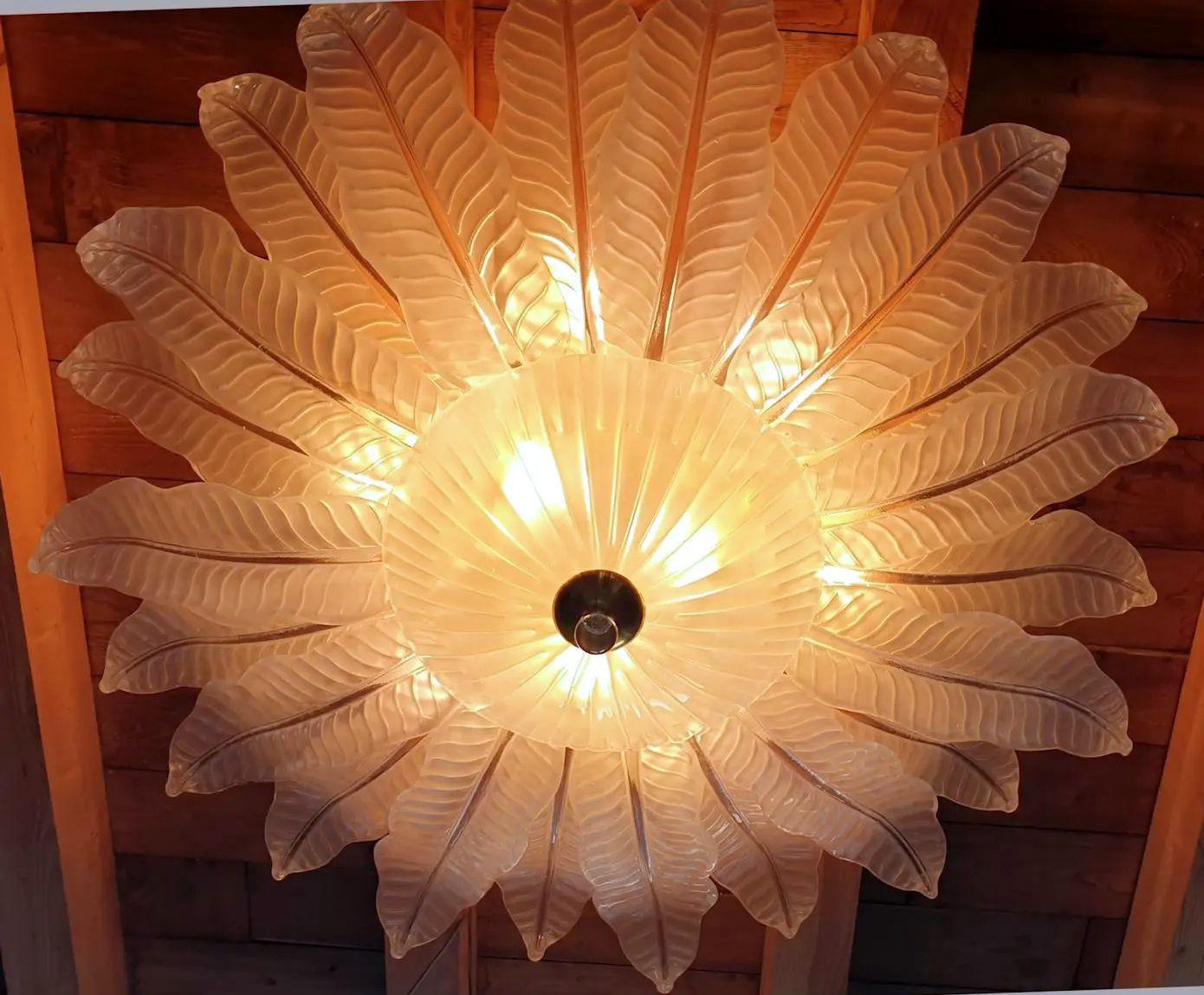 Extra large Leaf Murano glass Mid Century Modern flush-mount chandelier, by Barovier and Toso, Italy 1970s.
The Vintage Chandelier is made of large frosted Murano glass leaves and a center bowl, on a gold plated frame.
The glass is translucent,