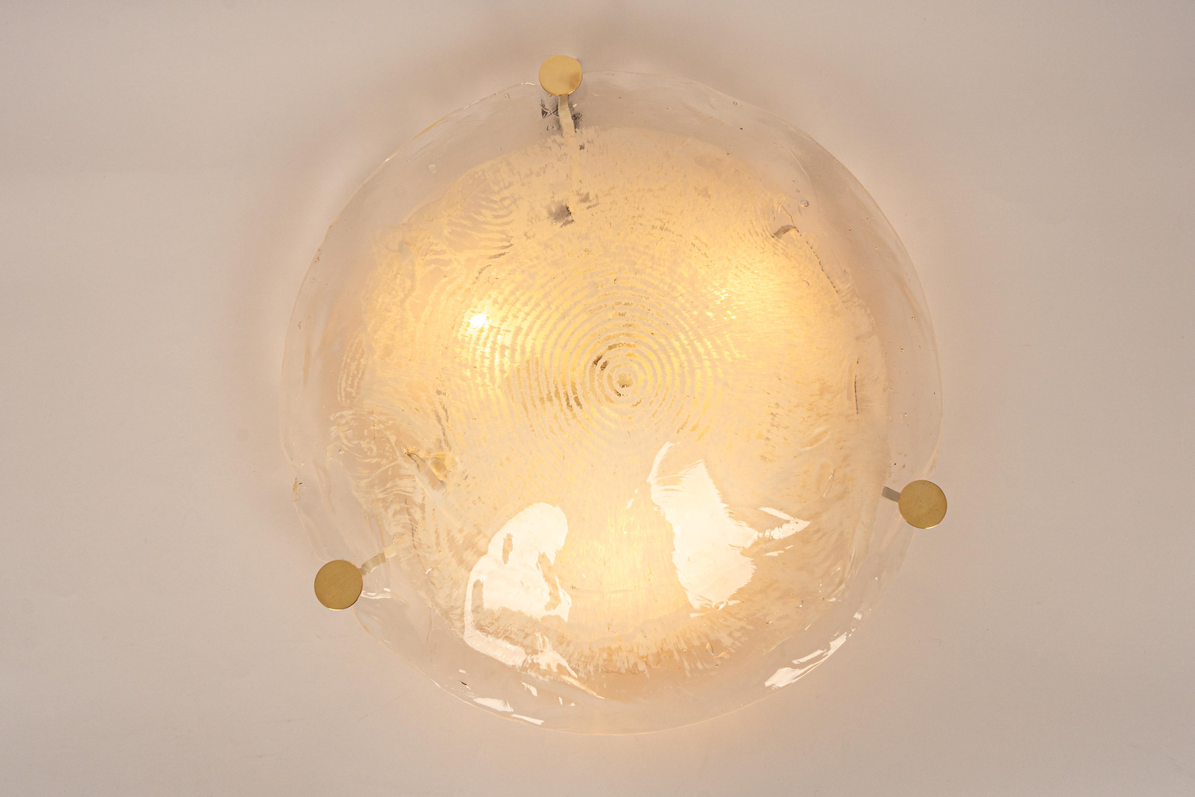 Large flush mount lights designed by Kalmar, Austria, 1970s
Wonderful large organic Murano glass Clear with a light brown tone.
High quality and in very good condition. Cleaned, well-wired, and ready to use.
Model: Undine

The fixture requires