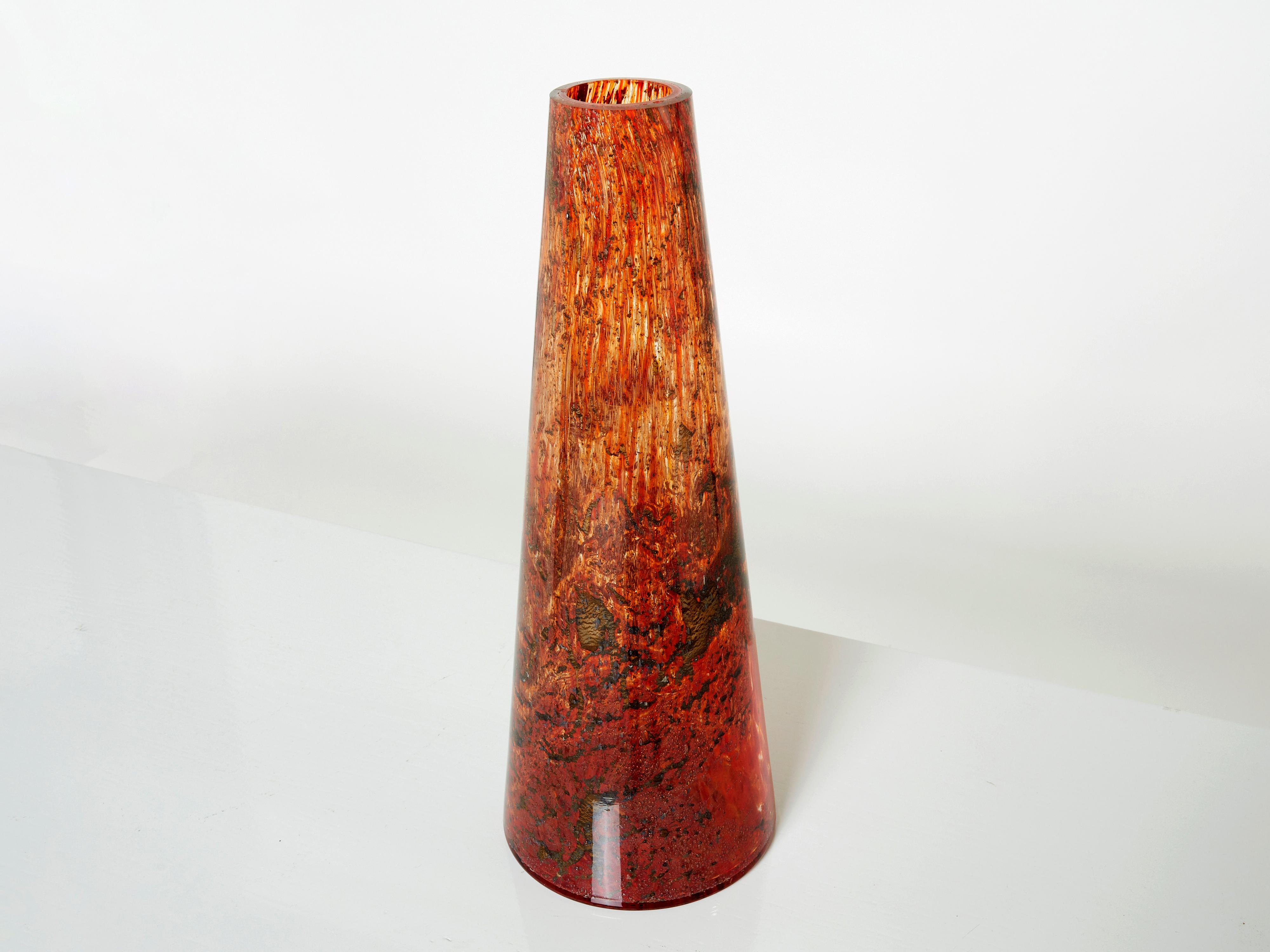 Beautiful tall Murano glass vase made in the 1970s. This vase has eye-catching colors, with brown inclusions submerged into orange and red glass. It is quite big and heavy, and has a wonderful presence. Found in a very good vintage condition.
  