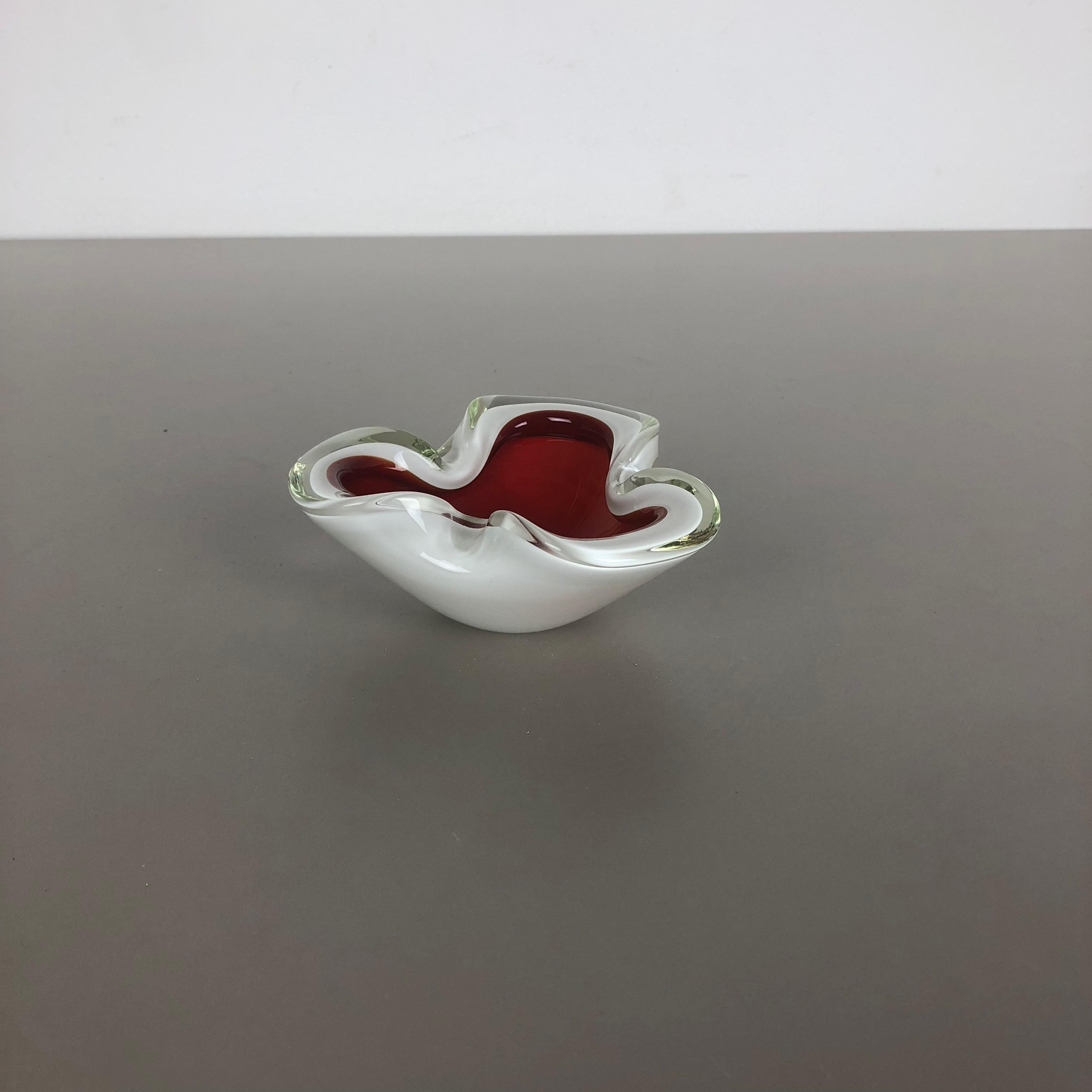 Article:

Murano glass bowl, ashtray element


Origin:

Murano, Italy


Decade:

1970s



This original vintage glass bowl element, ash tray was produced in the 1970s in Murano, Italy. It is made in Sommerso technique and has a