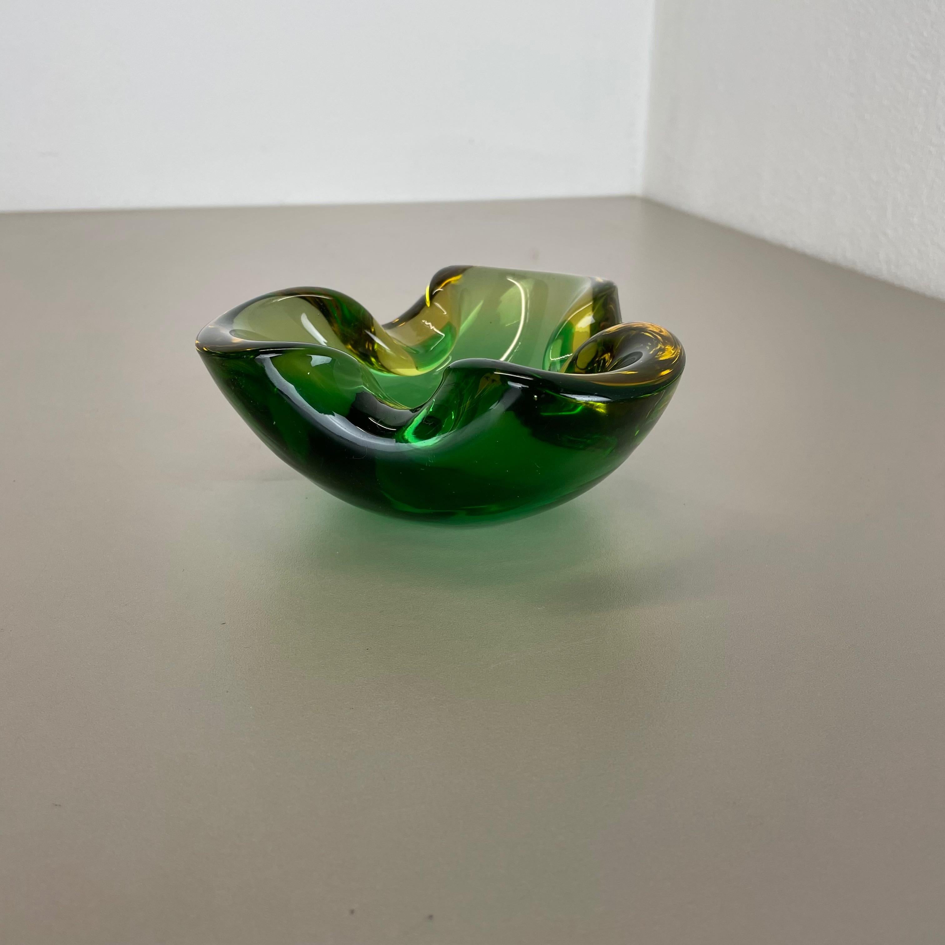 Article:

Murano glass bowl, ashtray element


Origin:

Murano, Italy


Decade:

1970s



This original vintage glass bowl element, ash tray was produced in the 1970s in Murano, Italy. It is made in Sommerso technique and has a