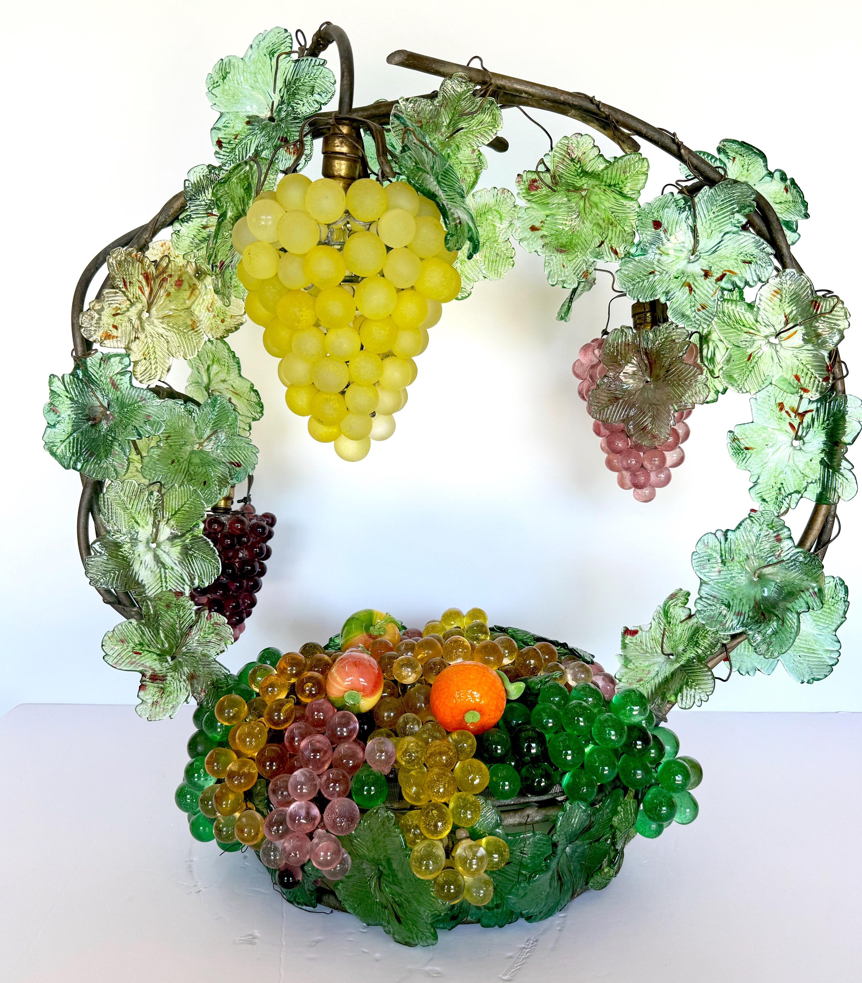 A Large Murano Glass Multi-Colored Basket of Fruit Table Lamp
Italy, circa 1950s

A stunning large Murano glass multi-colored basket of fruit table lamp from Italy, circa 1950s. This exquisite piece exemplifies the imaginative artistry of Murano