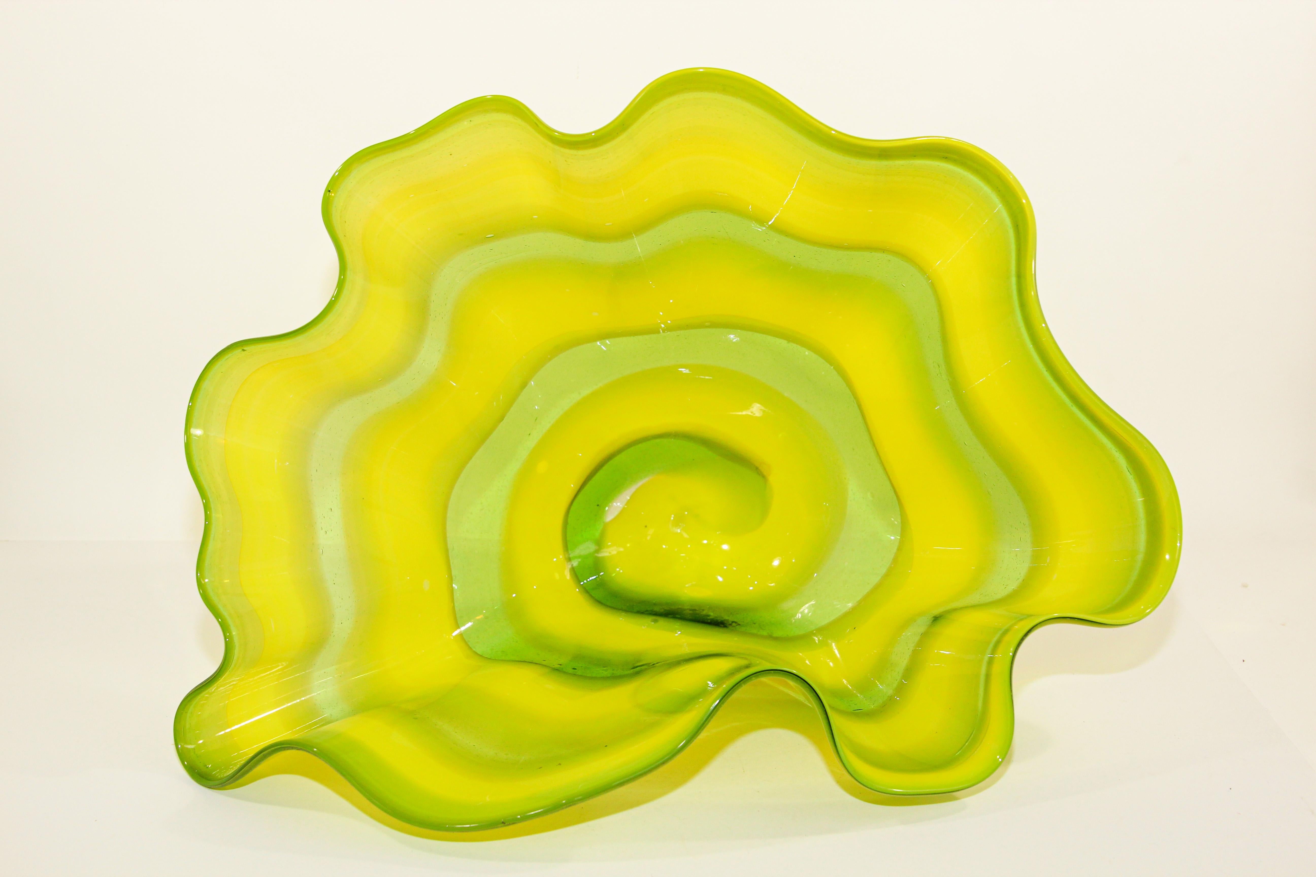 Large Murano glass green and yellow sea form bowl, in the style of Chihuly.
A stunning art work large scale with seamless color transition of greens and yellow.
Hand blown contemporary glass art.
The bowl has 19 inch width x Varying 13.75 inch