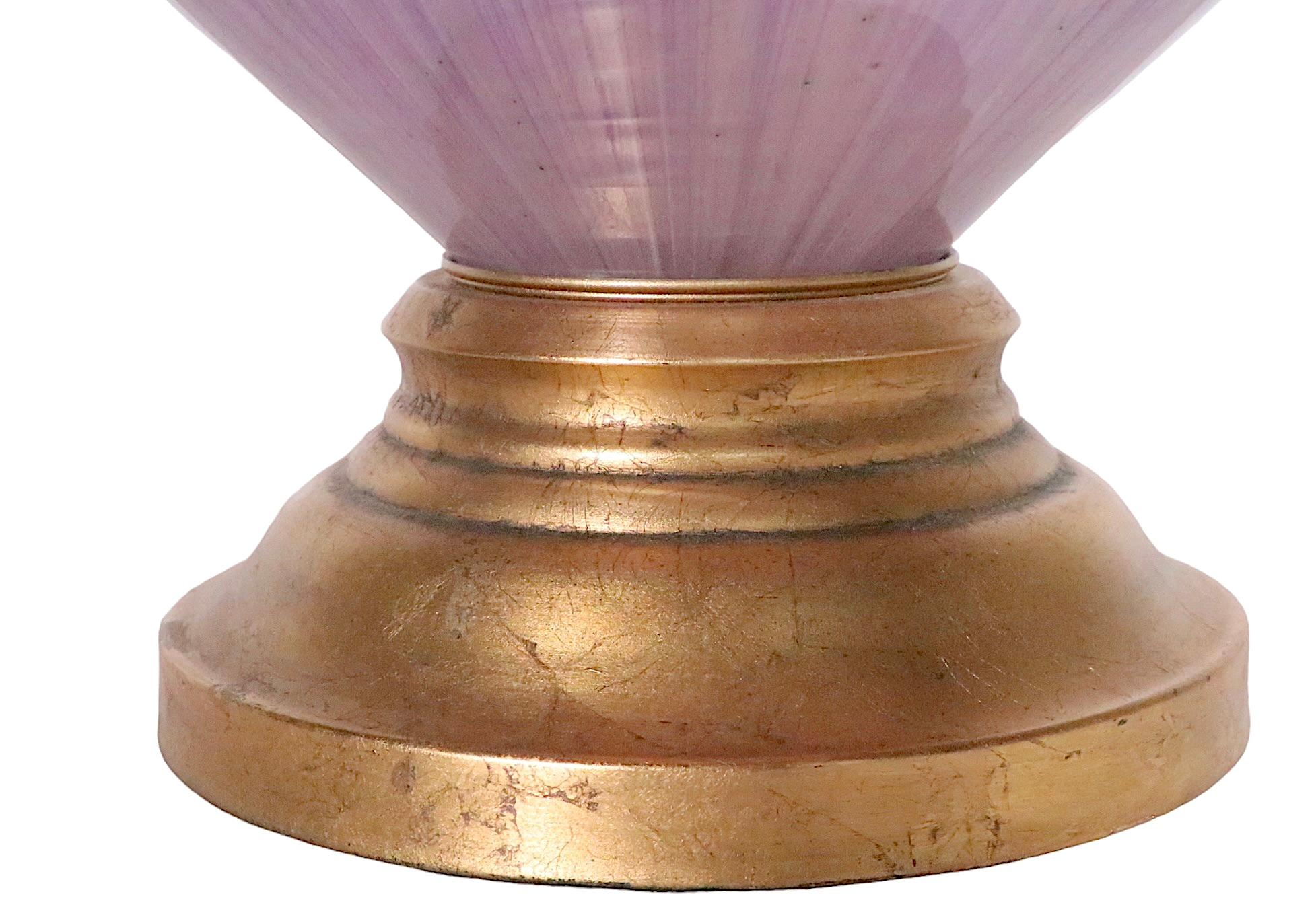 Elegant, voguish, and chic Italian art glass table lamp attributed to the Marlboro Lamp Co. The lamp is in an intriguing lavender tone, with a faux gold gilt base, it is excellent, original, clean and working condition. 
 Total H 50.5 x H to Top of