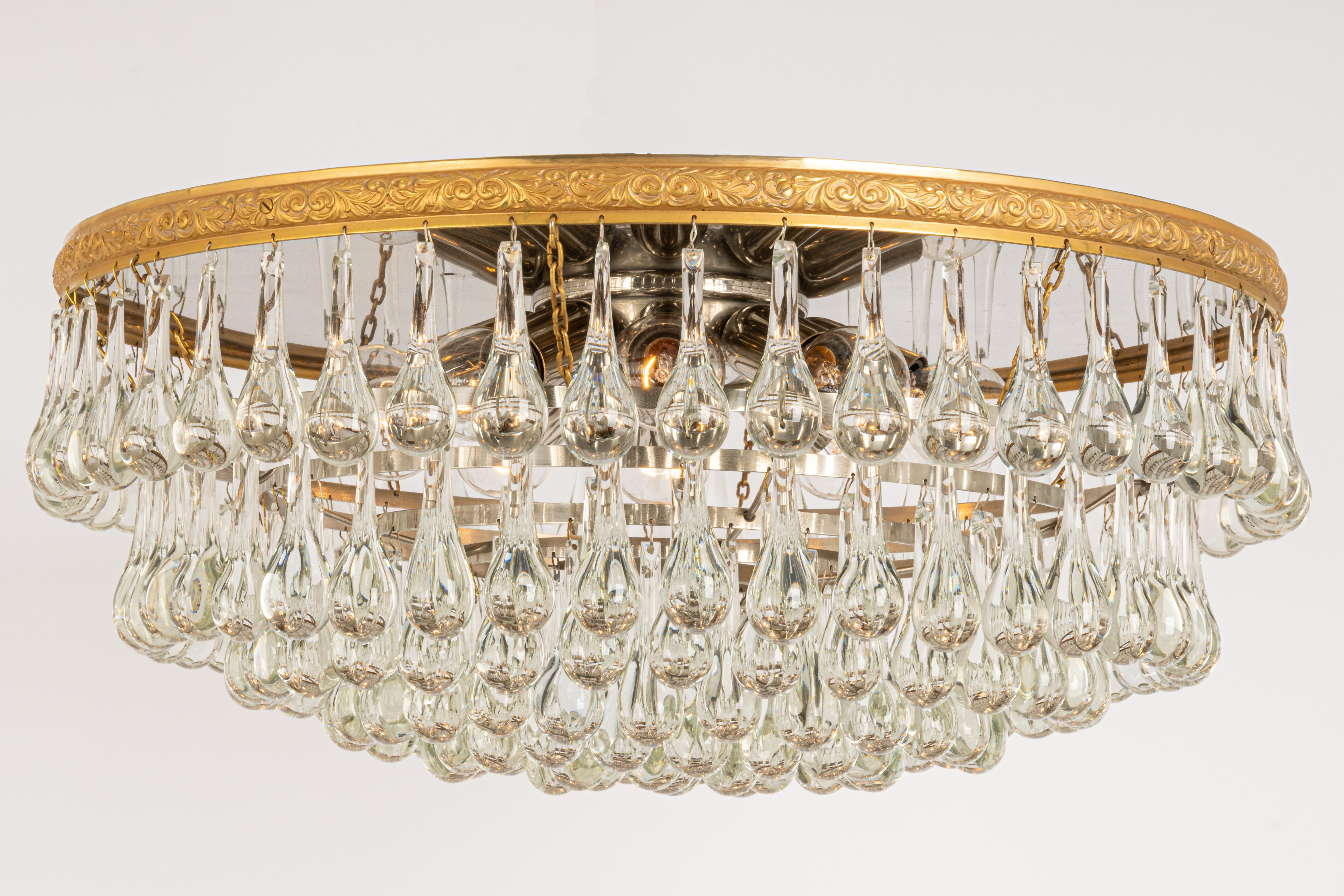 A stunning chandelier by Christoph Palme, Germany, manufactured in 1970s. It’s composed of Murano tear drop glass pieces on metal /brass frame.
High quality of materials.

Sockets: It needs 10 x E14 base bulbs to illuminate. (max. 40 W for each