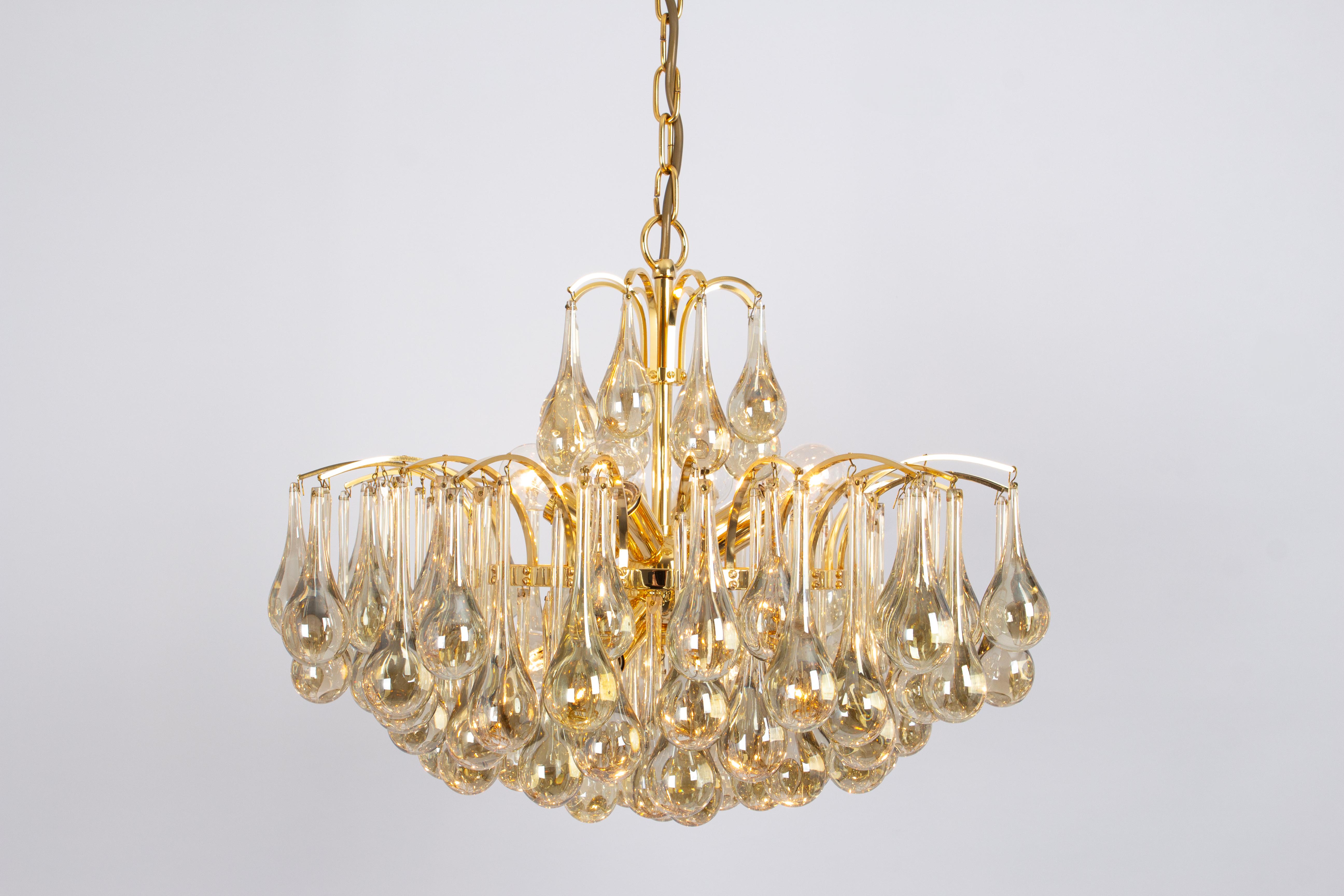 Stunning chandeliers by Christoph Palme, Germany, manufactured in the 1970s. It’s composed of Murano teardrop glass pieces on a gilded brass frame.

High quality and in very good condition. Cleaned, well-wired, and ready to use. 

The fixture
