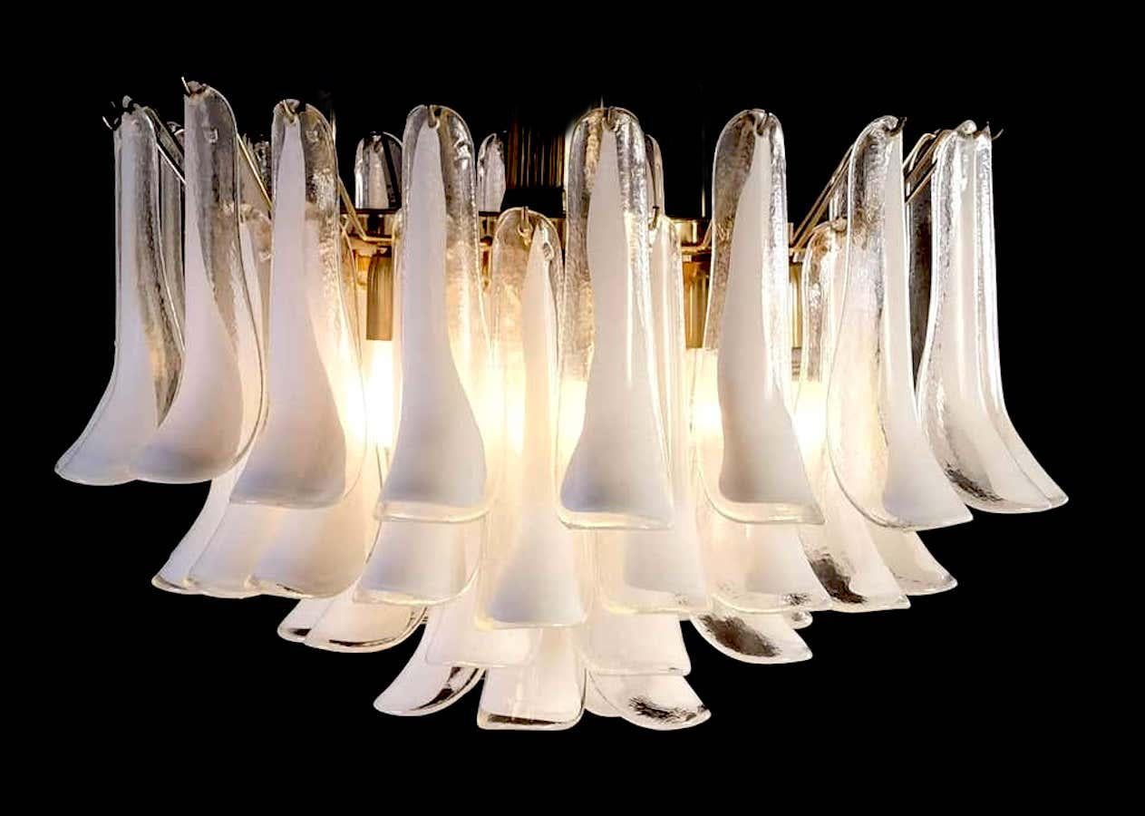 Amazing chandelier with 49 petals white hand blown glass by Murano.

Measures: height with chain cm 80, (31.5 in.) without chain cm54 (21 in.) diameter cm 65 (25.6 in.)
Five E27 light bulbs.
Variations are available on request. (Size, finishes,