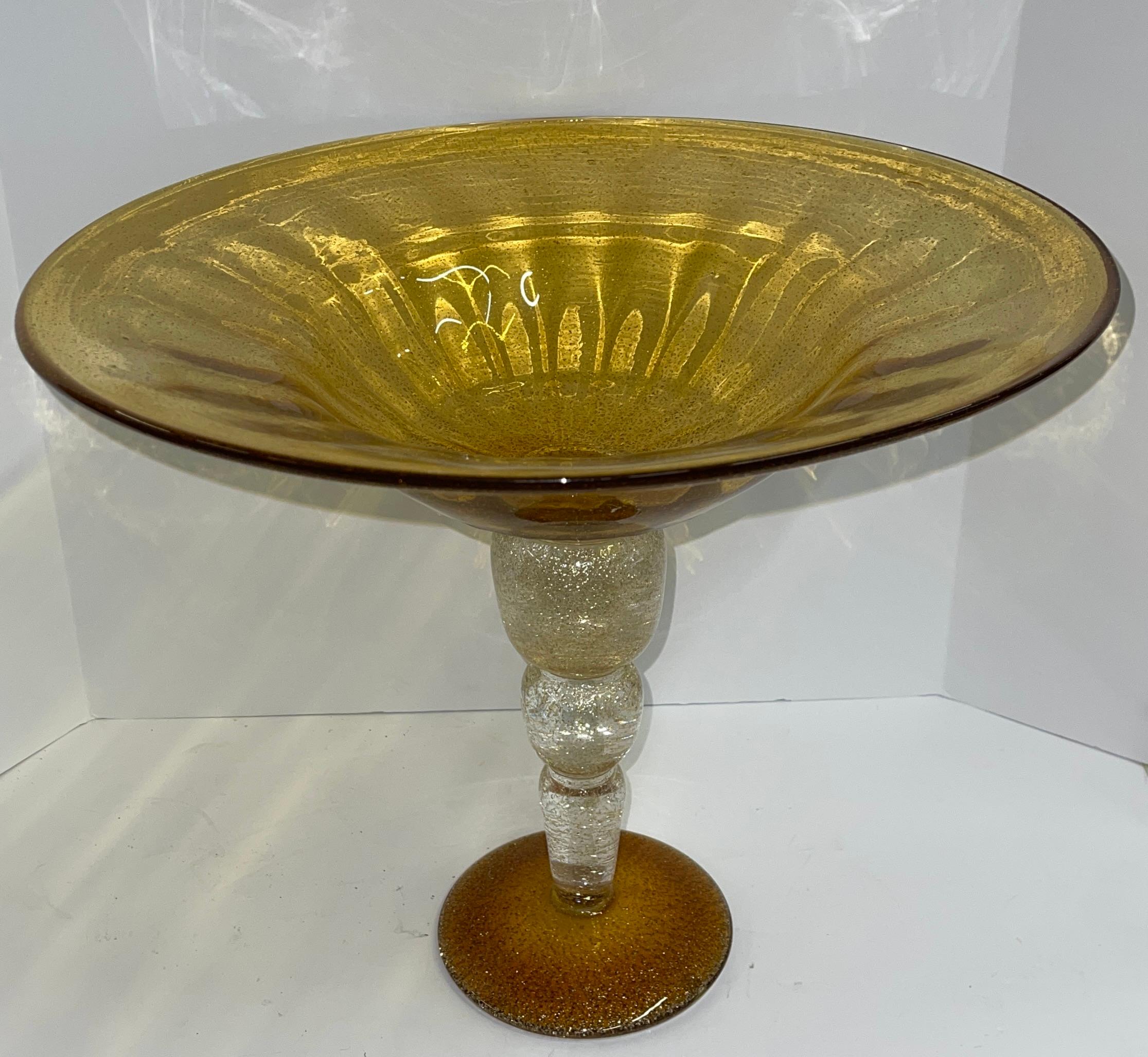 Beautiful large Murano gold flecked Tazza. Approximately 16.25 inches in diameter and 13.75 inches tall. In good condition with no chips. Retains a made in Italy gold foil tag on the bottom.