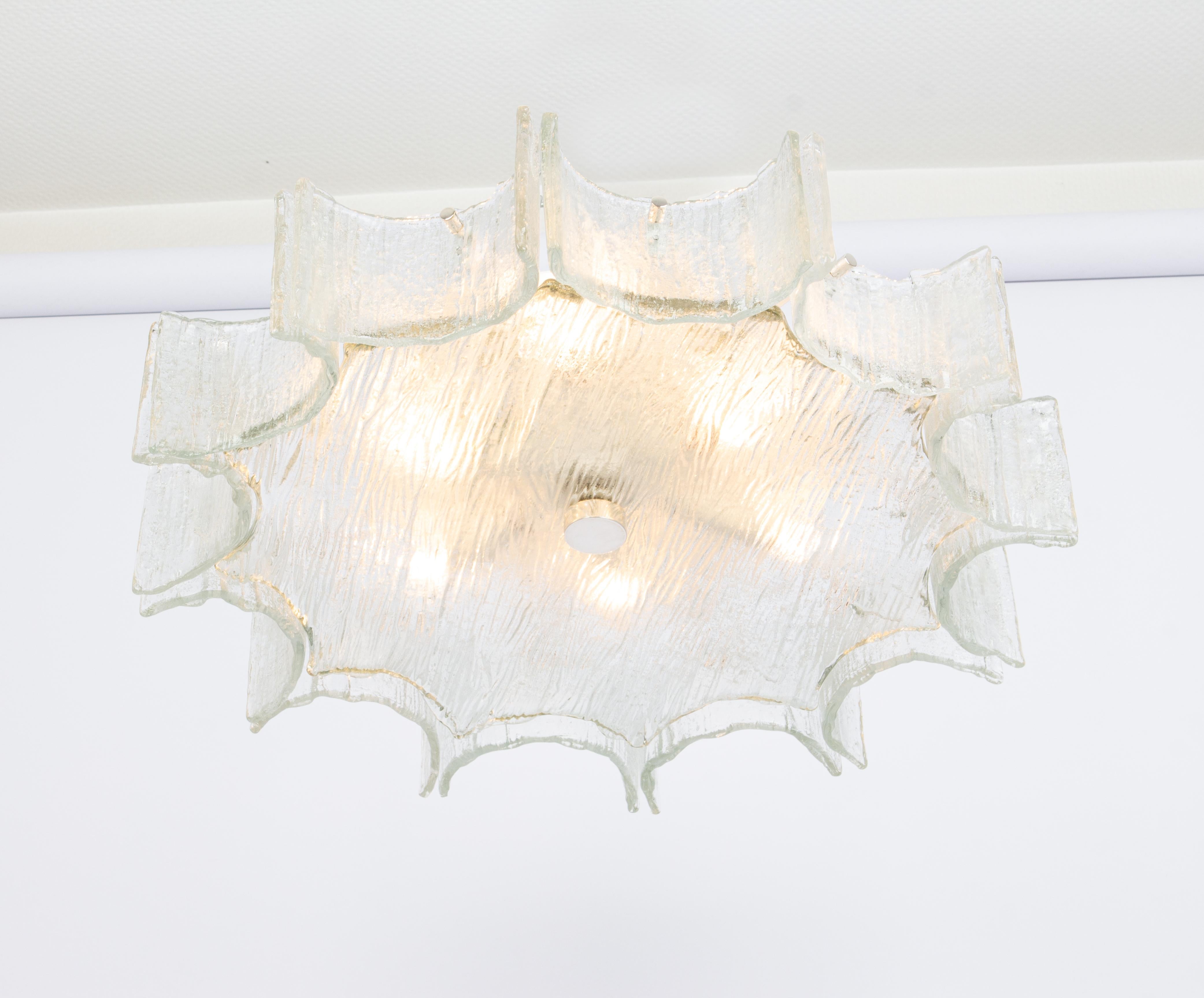 Fantastic star shape chandelier by Kaiser, Germany, manufactured, circa 1960-1969. Curved Murano glasses suspended from a fixture and signed by the German maker Kaiser Leuchten.

Sockets: six x E14 candelabra bulbs.( max. 40 watt each) 
Light bulbs