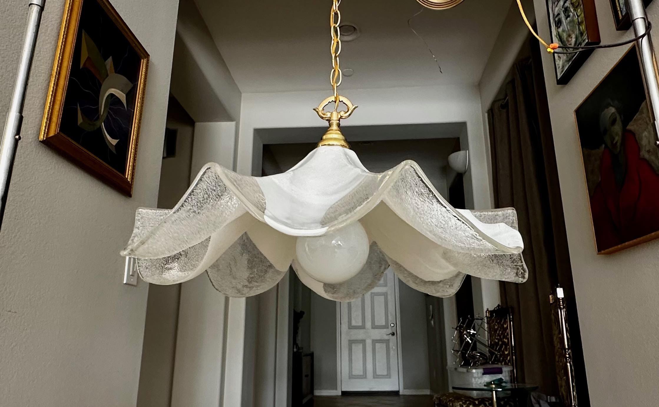 Very large Italian Mazzega flutted shape pendant ceiling light. The hand blown glass is clear and white, the inside has fine scattered particles of glass to defuse the light. Murano fixture uses regular A base bulb. The light bulb used in photos is