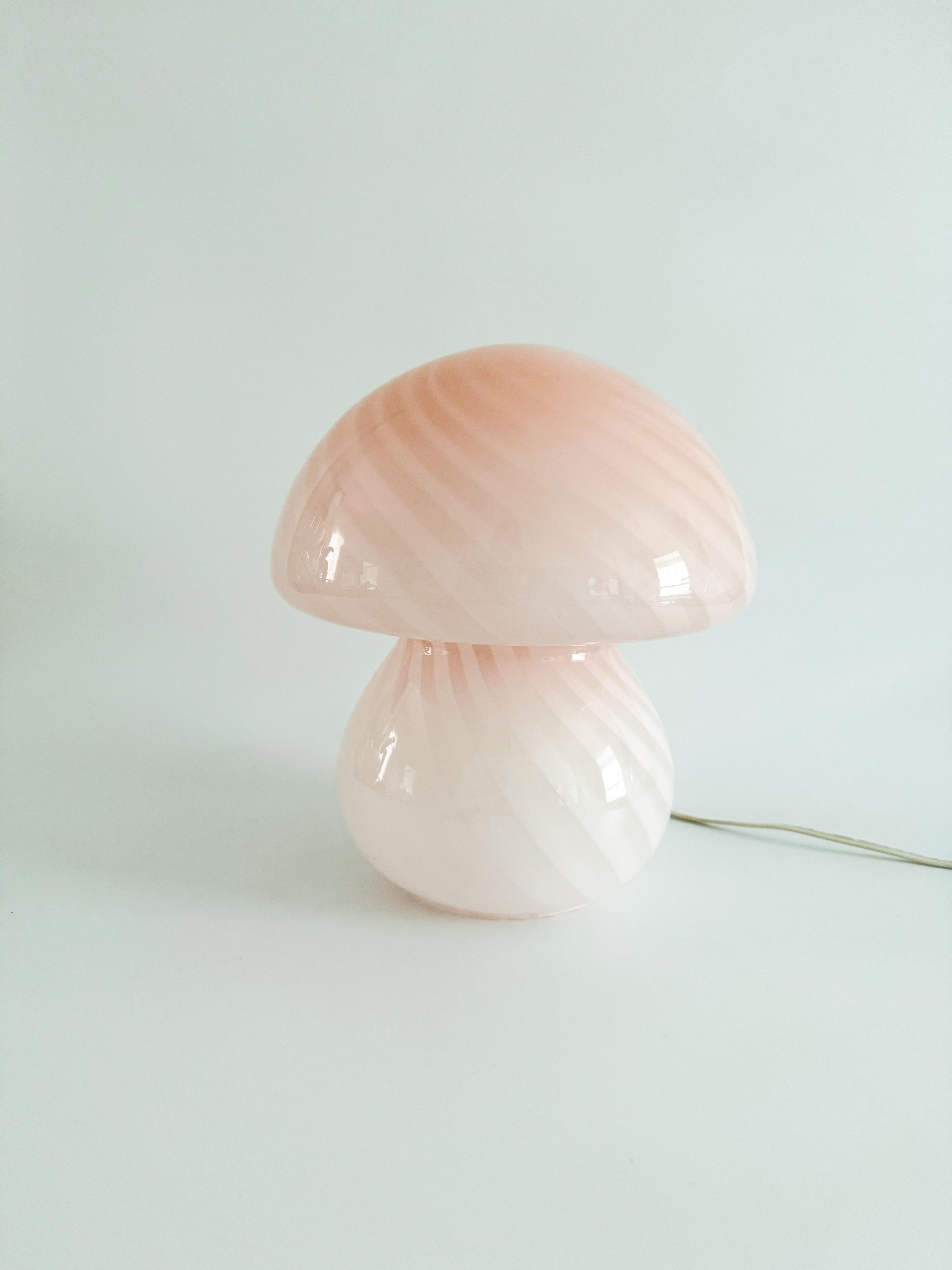 Wonderful large pale pink mushroom Murano lamp made in the 1970s. This amazing lamp is handmade from a single piece of art glass, mouth-blown and cased into its rare ‘fungo’ shape. It has been rewired with a North American plug.

In excellent