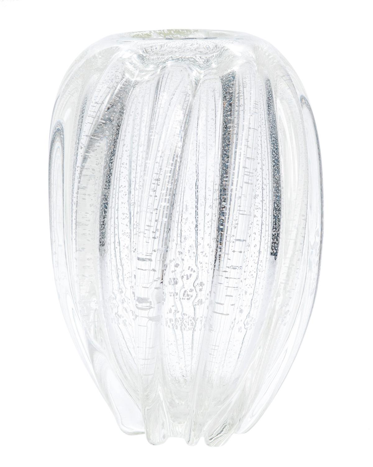 This stunning large and weighty twisted clear glass vase with flecks of silver infused in the body makes a bold statement in any room.
 