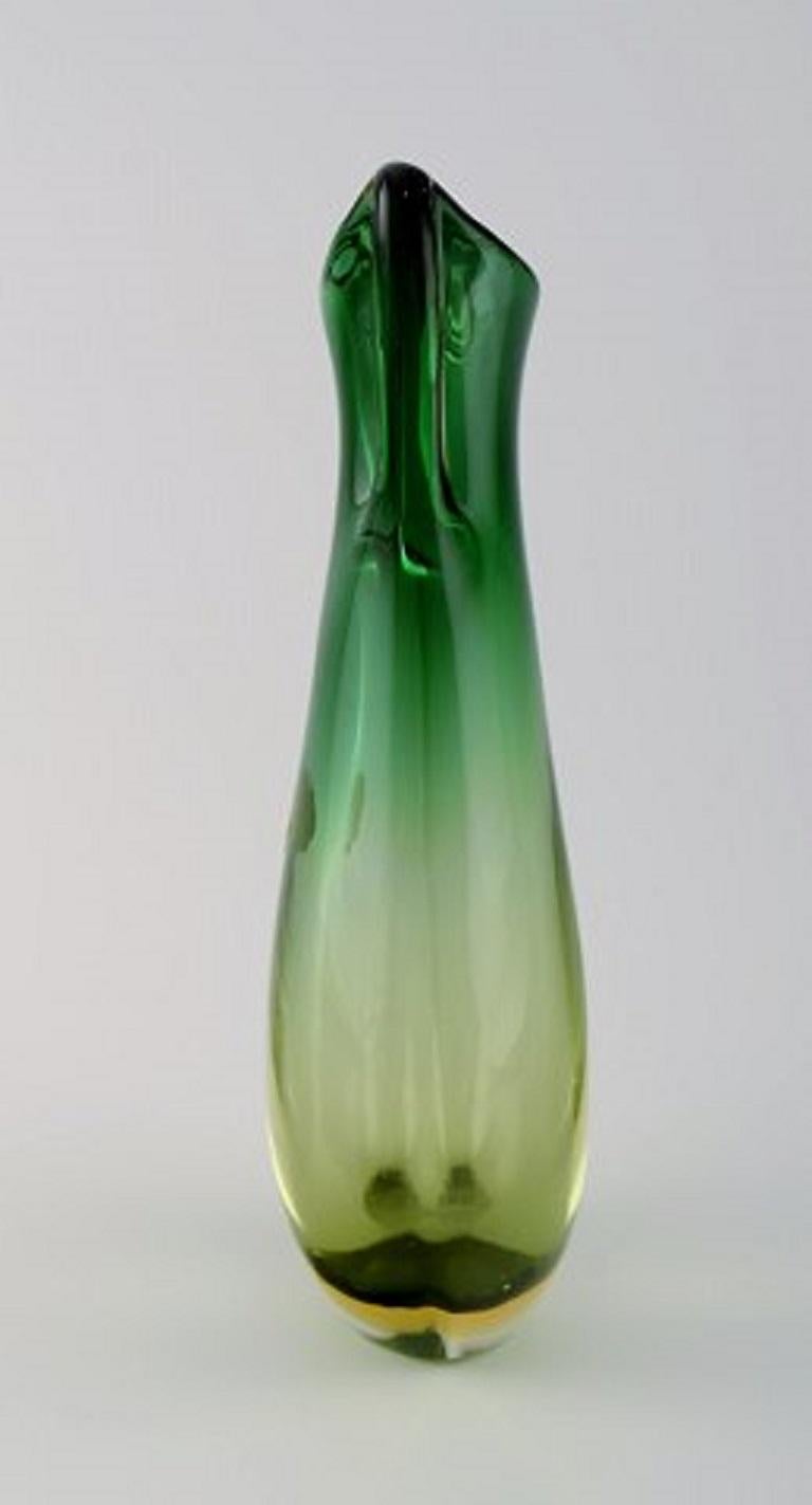 Large Murano vase in green and clear mouth blown art glass. Italian design, 1960s.
Measures: 24 x 11.5 cm.
In perfect condition.
Sticker