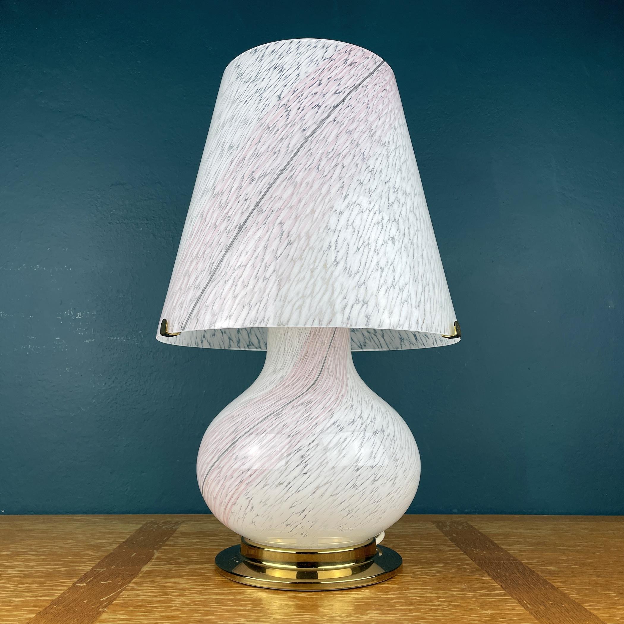 Large mushroom swirl Murano glass table lamp made in Italy in the 1970s. The beauty of the classic swirl glass makes this lamp a pleasure to look at. It has one light bulb above and three light bulbs in the base. Upper and lower bulbs can be