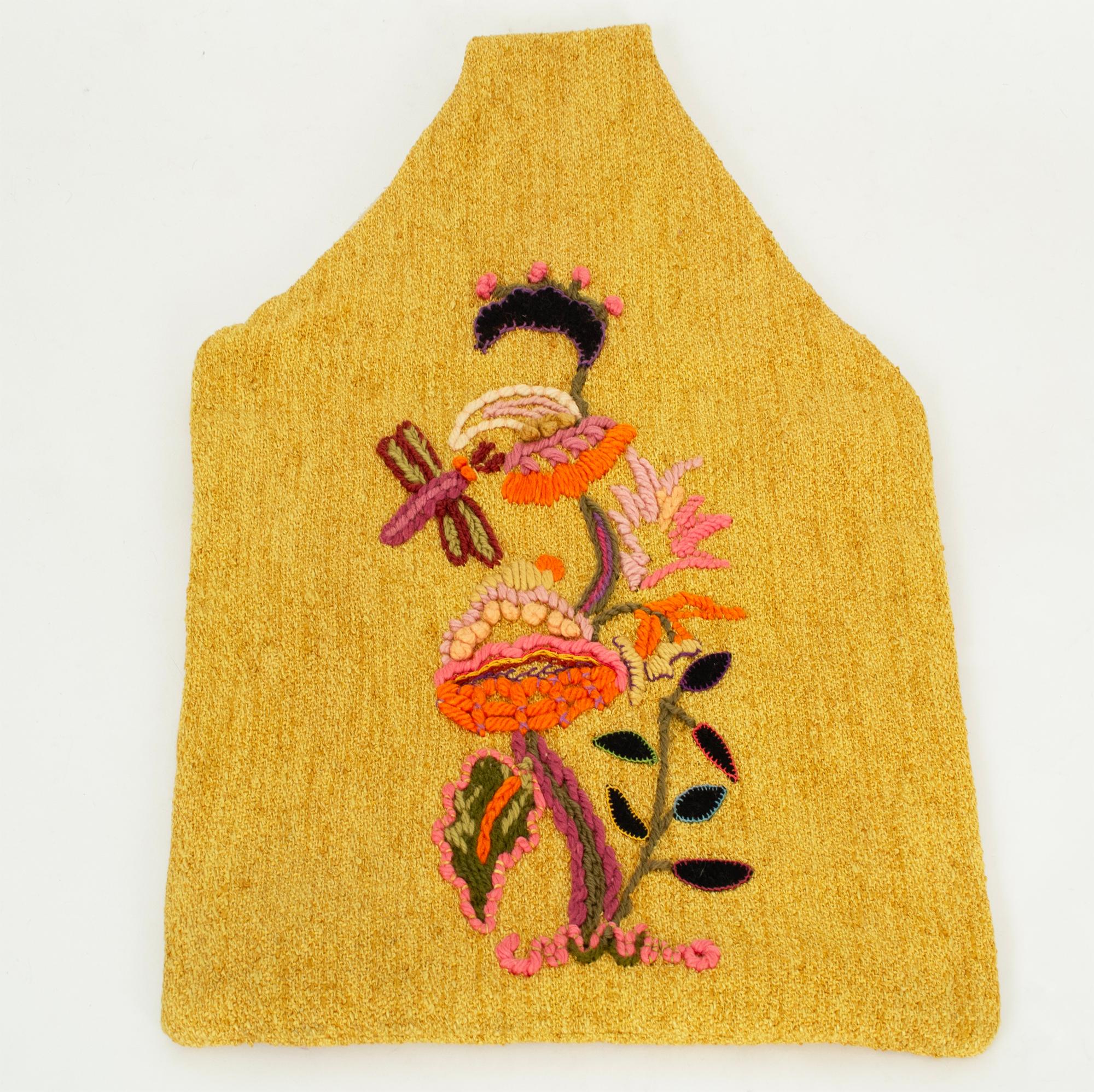 Oversize wool bouclé hobo tote bag featuring inset felt and yarn embroidery with mushroom and dragonfly motif on one side. Pale yellow nylon slub lining.

fabric: wool, nylon slub
noteworthy: may be gently hand or machine washed in cold water; lay