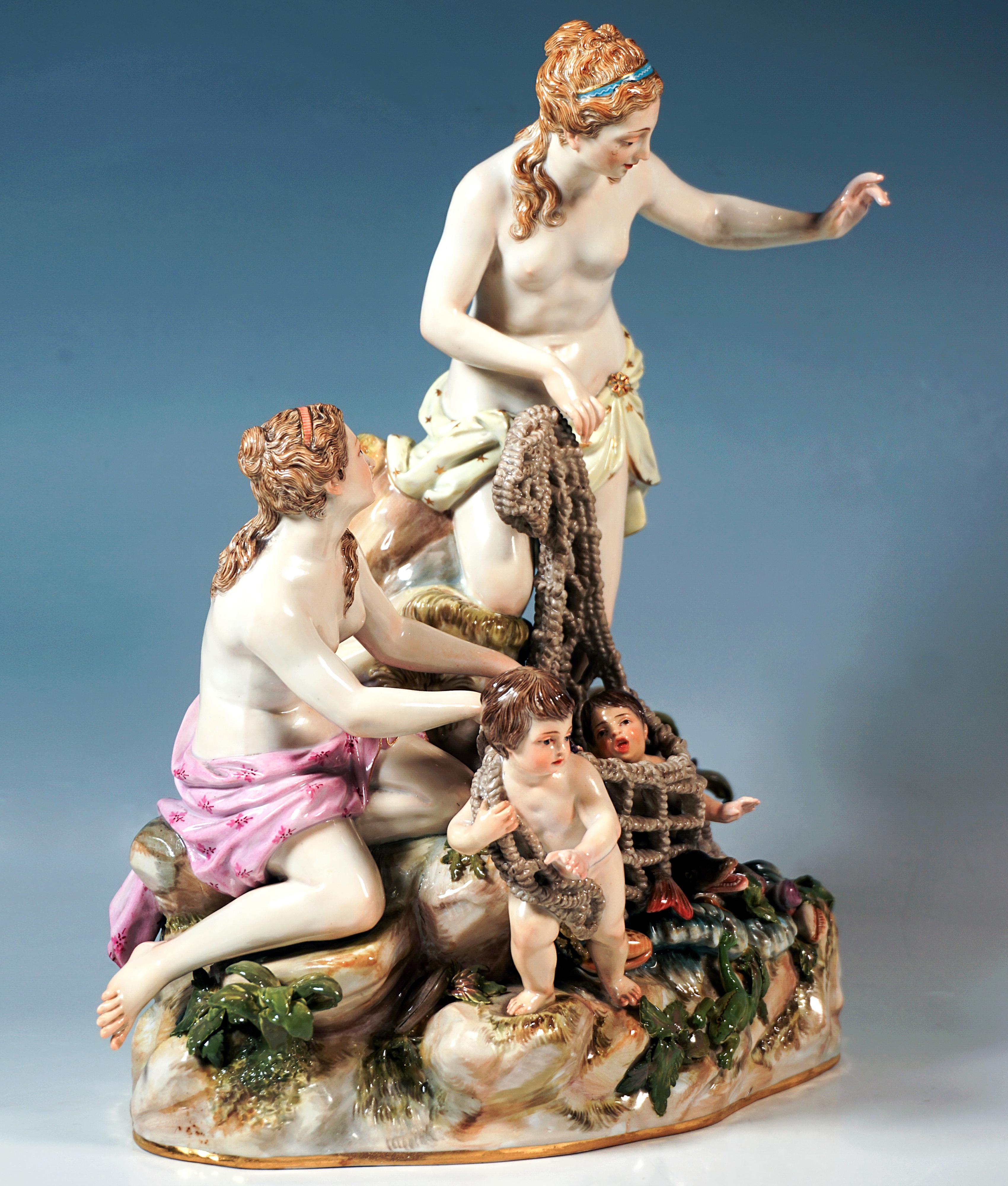 Excellent Meissen porcelain sculpture:
Very elaborate and lovingly designed group of figures: two young women with artfully pinned-up hair and wrapped in cloths tied around their loins, kneeling on a rock and using a puttos help to pull ashore the
