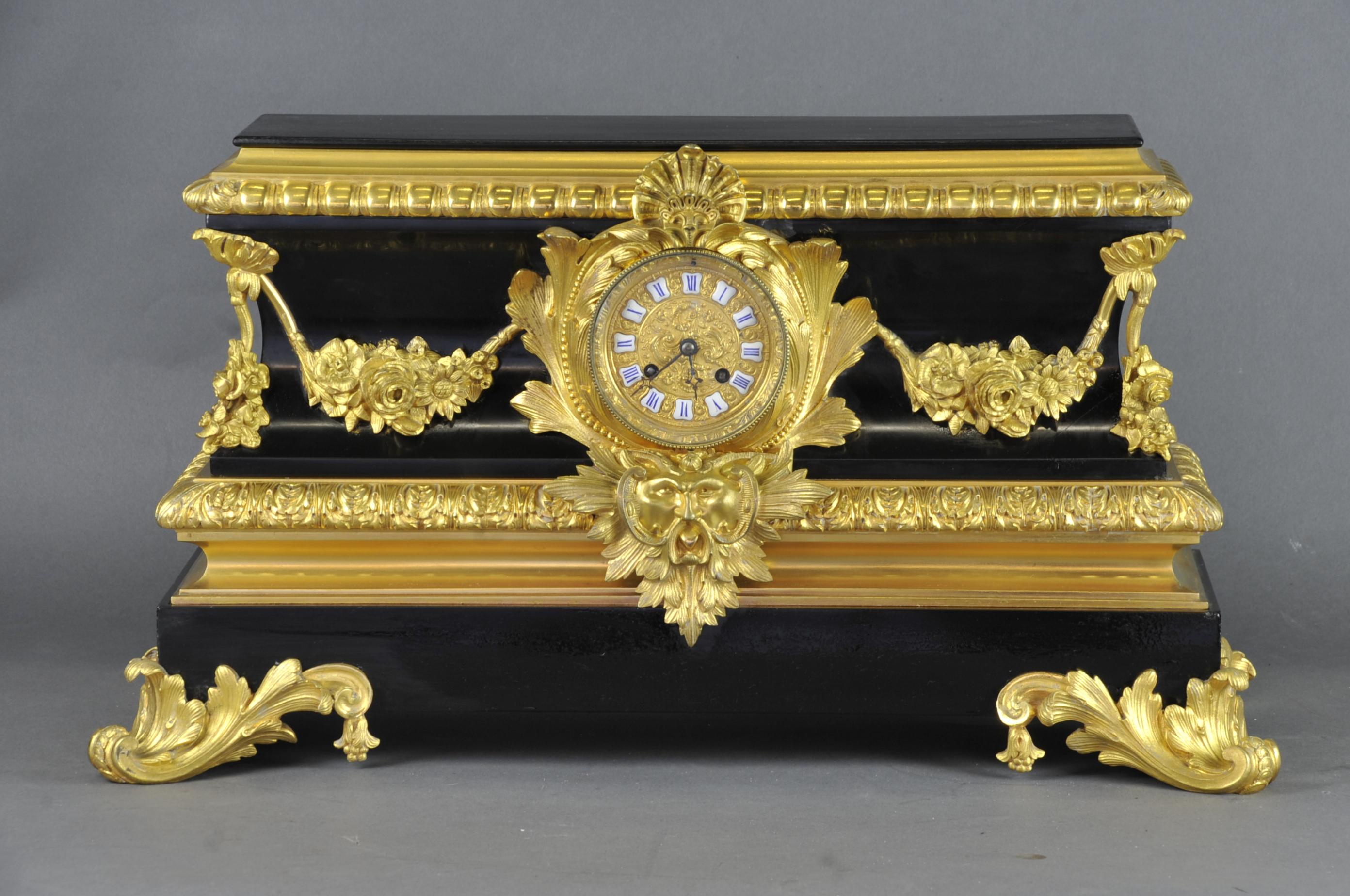 Large and very elegant Napoleon III period mantel clock in black Belgian marble and rich ornamentation in finely chiseled gilt bronze.
Wire movement signed by the house Raingo Frères in Paris. 
Operates but the balance is missing.