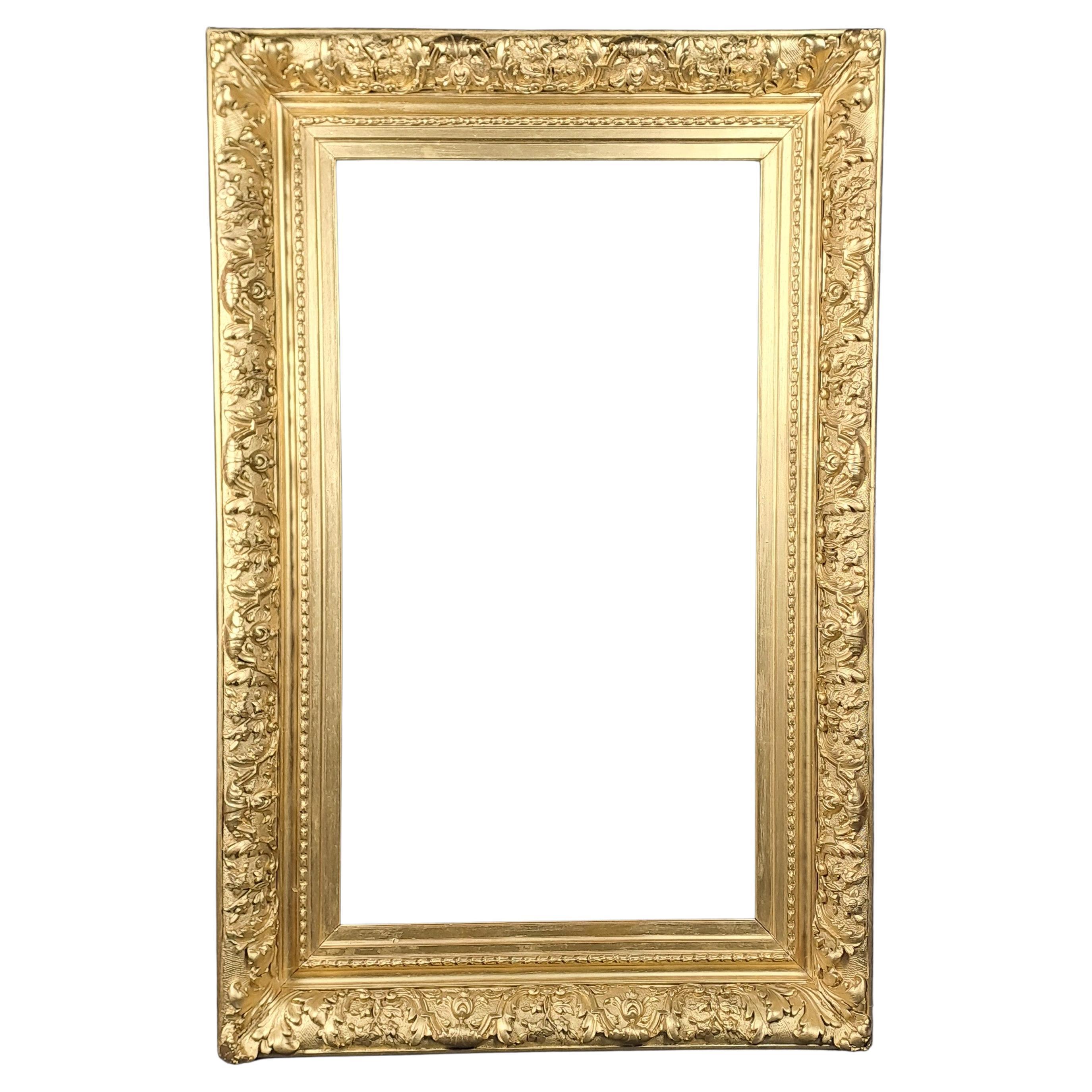 Gran marco Napoleón III de madera y estuco dorado