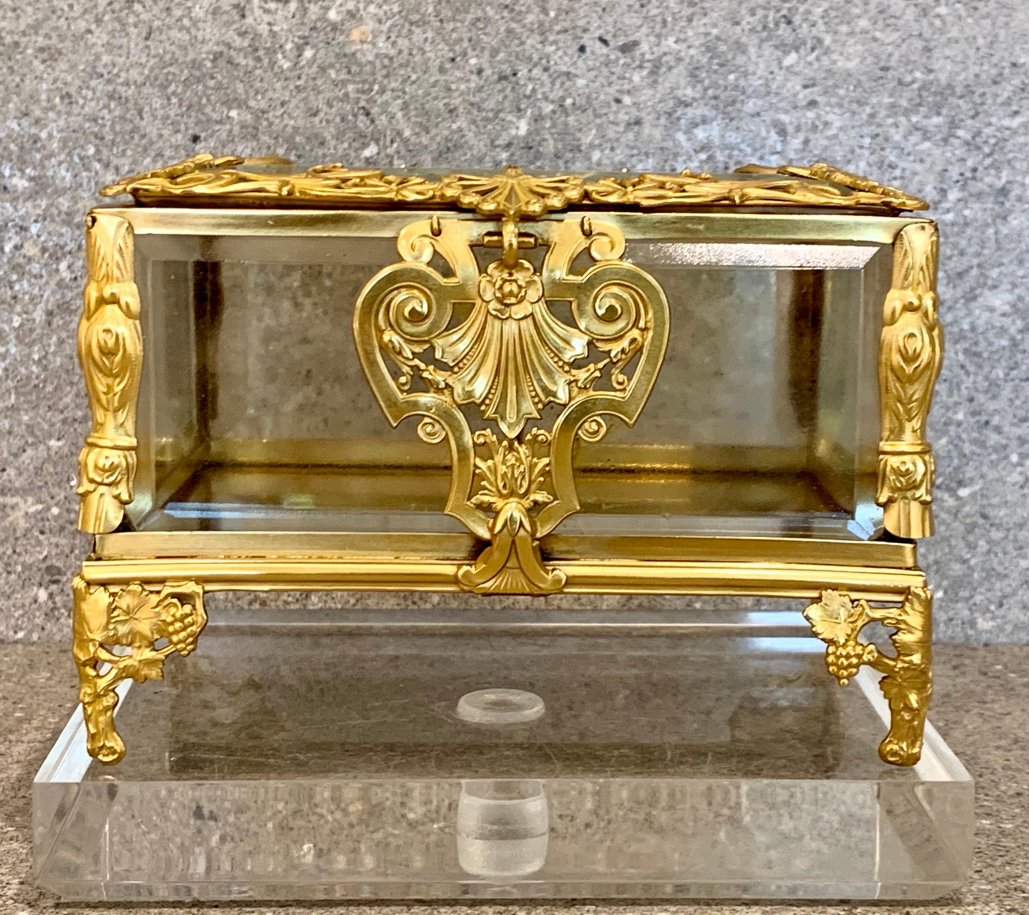 Perfectly executed in heavy crystal glass and Bronze. A superb example of a French Casket. This fine box is decorated with high quality ormolu mounts. All the glass is heavily bevelled.
  