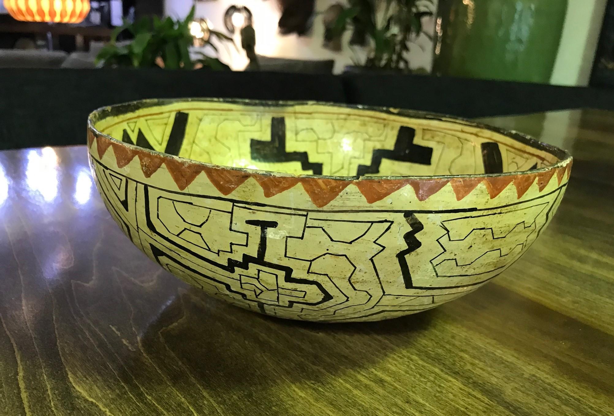 A wonderful geometric patterned and designed hand painted and glazed Native American earthenware bowl. We believe it was made by the Shipibo-Conibo people, an indigenous people along the Ucayali River in the Amazon rainforest in Peru.

Would be a