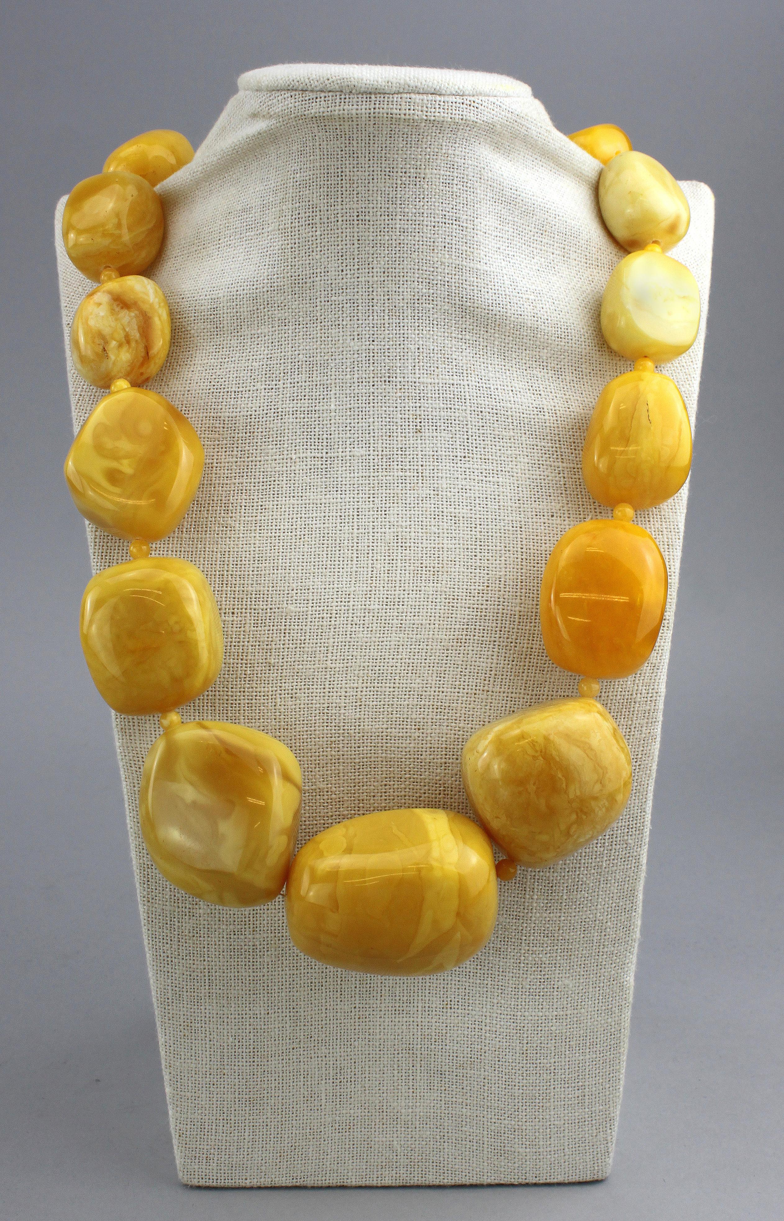 Large natural Baltic white amber necklace.
Circa 1950's

Dimensions -
Length : 65.5 cm
Width : 4.3 cm
Weight : 239 grams

Amber - 
Treatment : Natural
Large Amber Stone Size : 4.8 x 4.2 x 3.2 cm
Medium Stone Size : 4.5 x 4 x 3 cm

Condition: