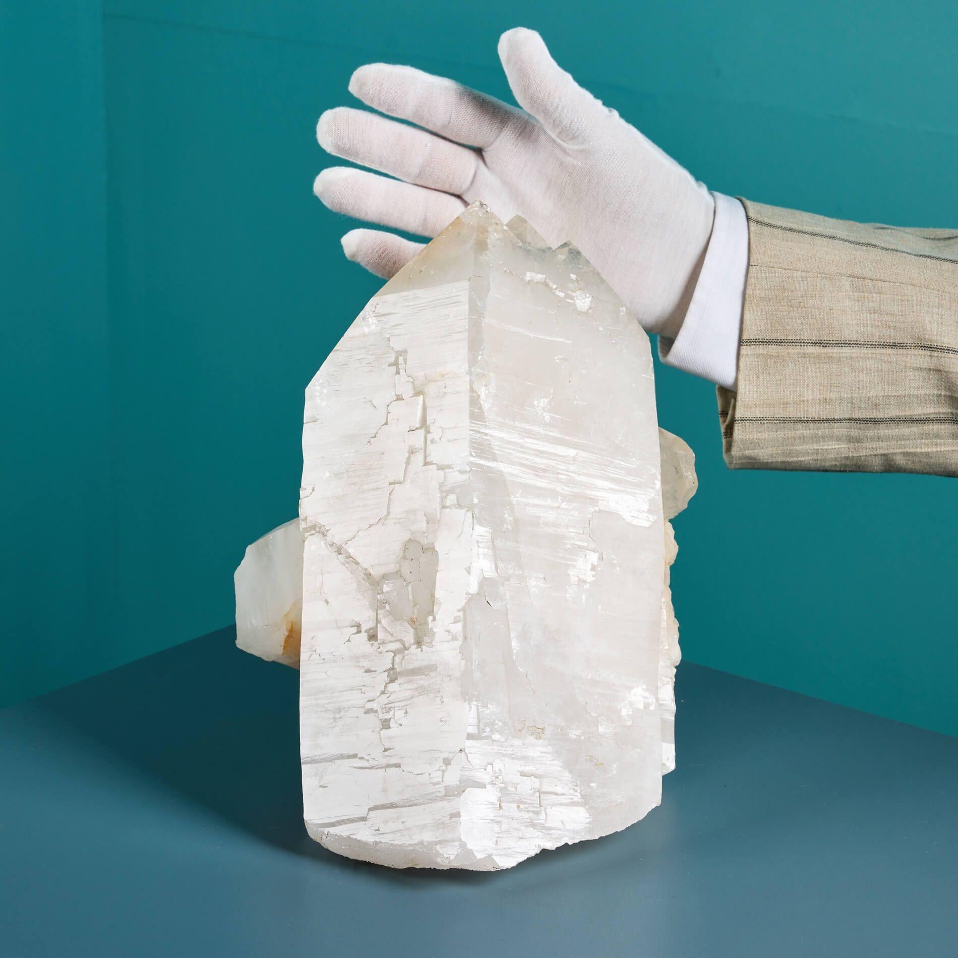 A large calcite specimen sourced from an ex British private collection.

Formed over millions of years, this natural calcite specimen originates from Lesotho, South Africa, showcasing spectacular well terminated points with a pale white, almost